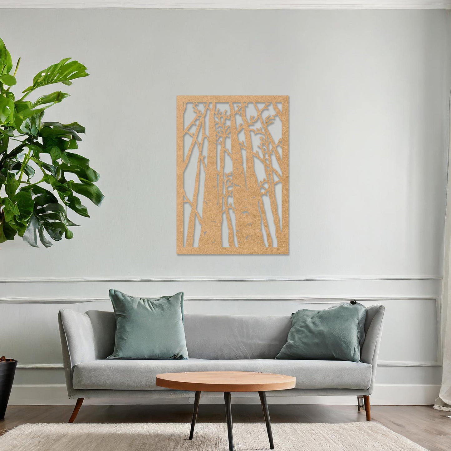 Wooden wall art featuring a forest design with tall, slender trees and intricate branches, displayed on a neutral wall within modern room decor, showcasing its natural and artistic craftsmanship.