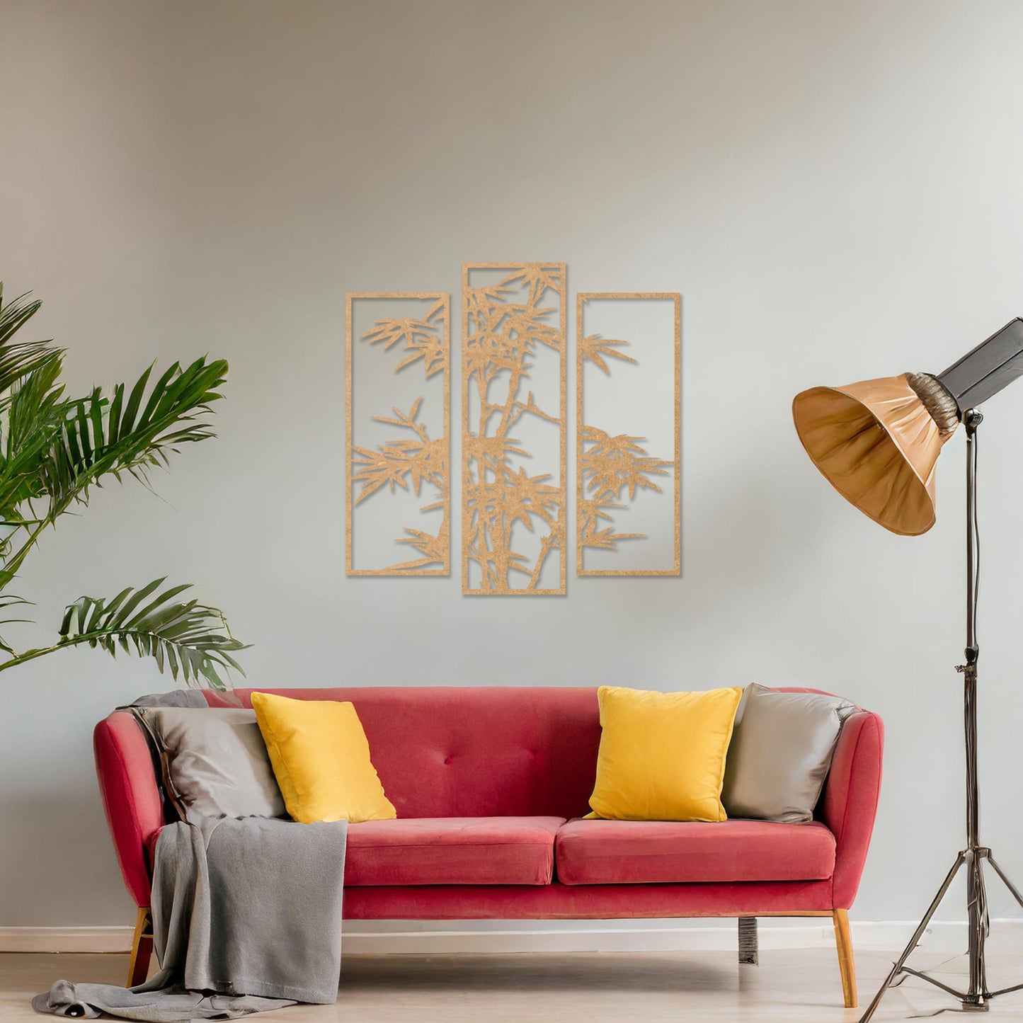 Wooden wall art consisting of three panels featuring a bamboo design with detailed leaves and stalks, displayed on a neutral wall within modern room decor, highlighting its elegant and nature-inspired craftsmanship.