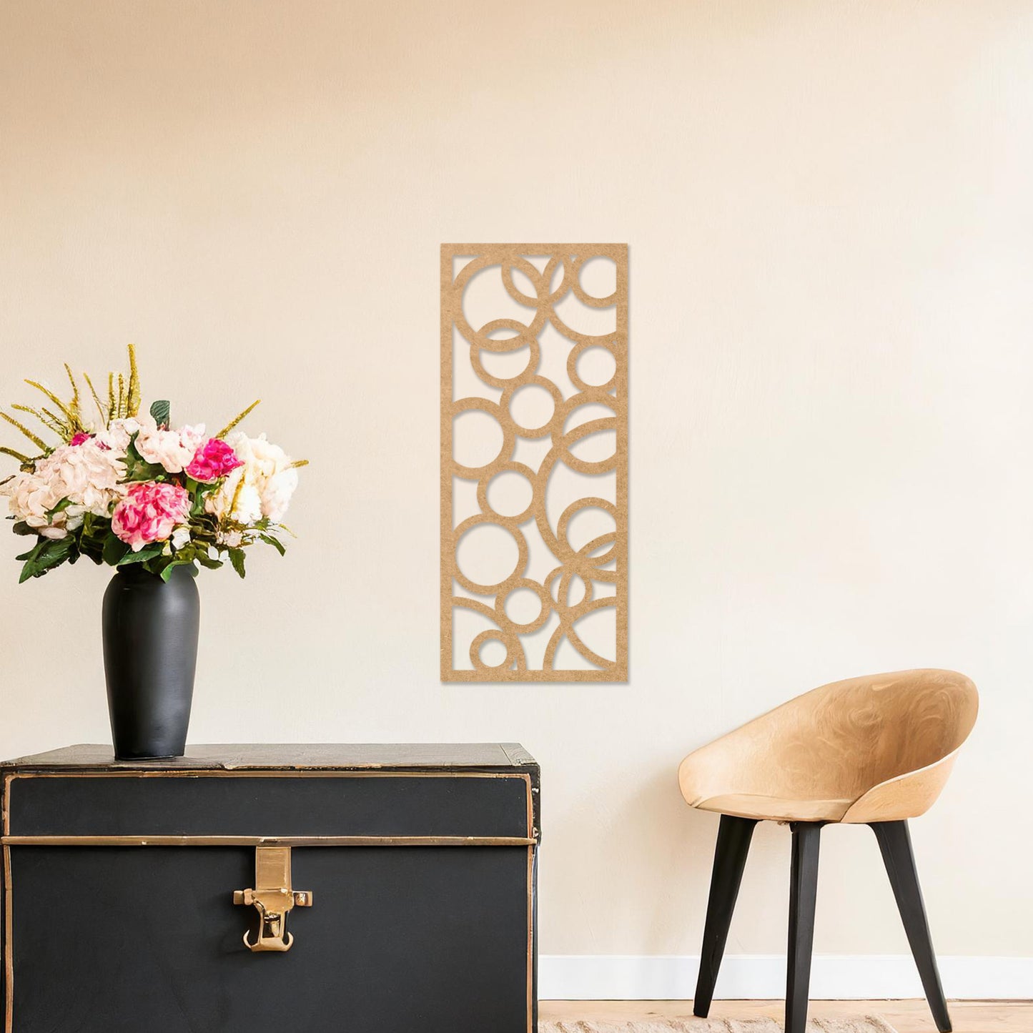 A rectangular wall art piece featuring an abstract design of overlapping circles of various sizes. The artwork is displayed on a neutral wall in a modern room,