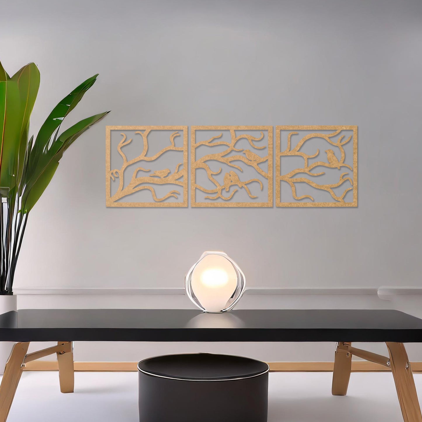 A three-panel wall art showcasing a design of birds perched on delicate tree branches. The intricate artwork is displayed on a neutral wall in a modern room, enhancing the natural and elegant ambiance of the decor.