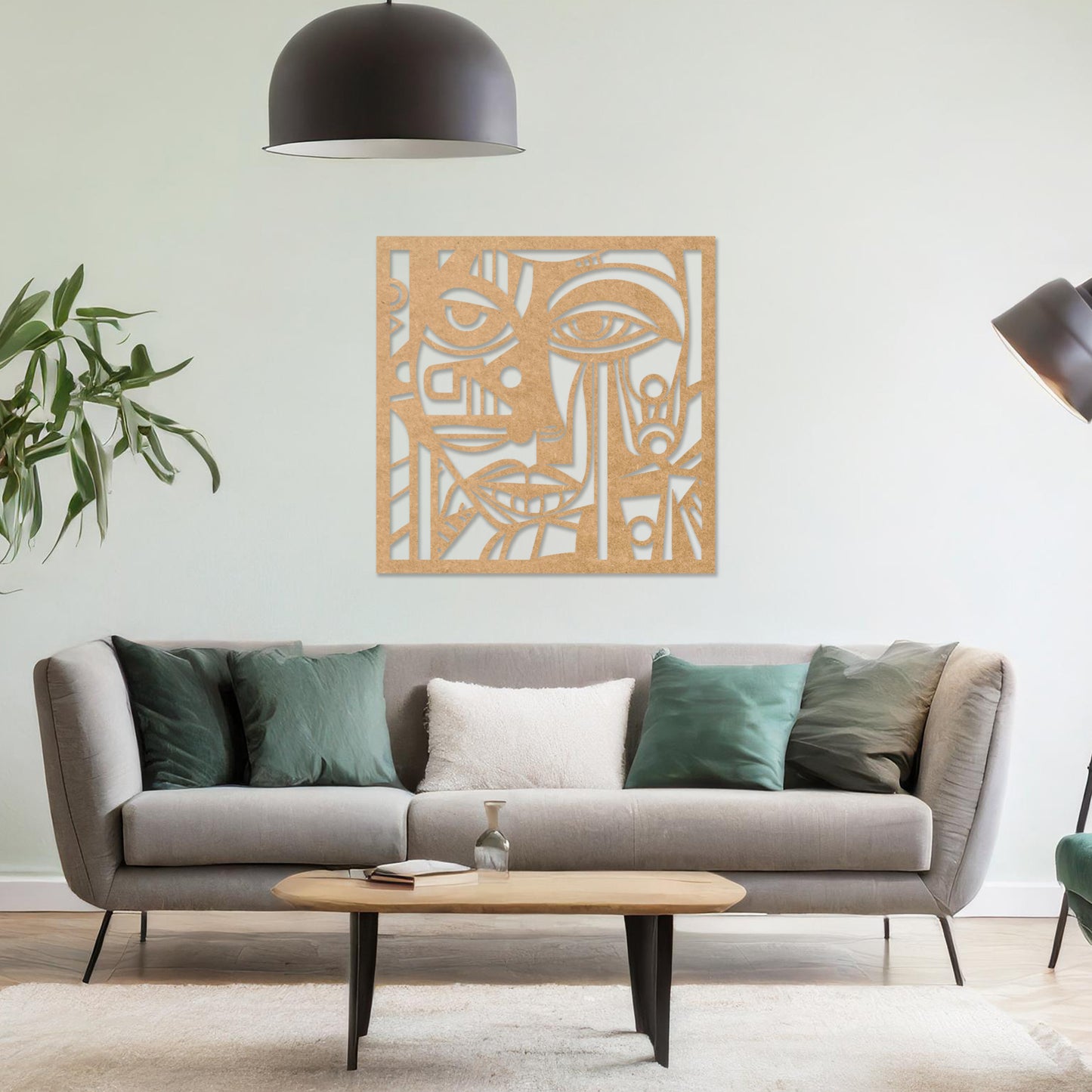 Wall art featuring an abstract face design with geometric patterns and intricate details, creating a modern and artistic composition. The piece is displayed on a neutral wall within rustic-modern decor, adding a bold and expressive focal point to the space.