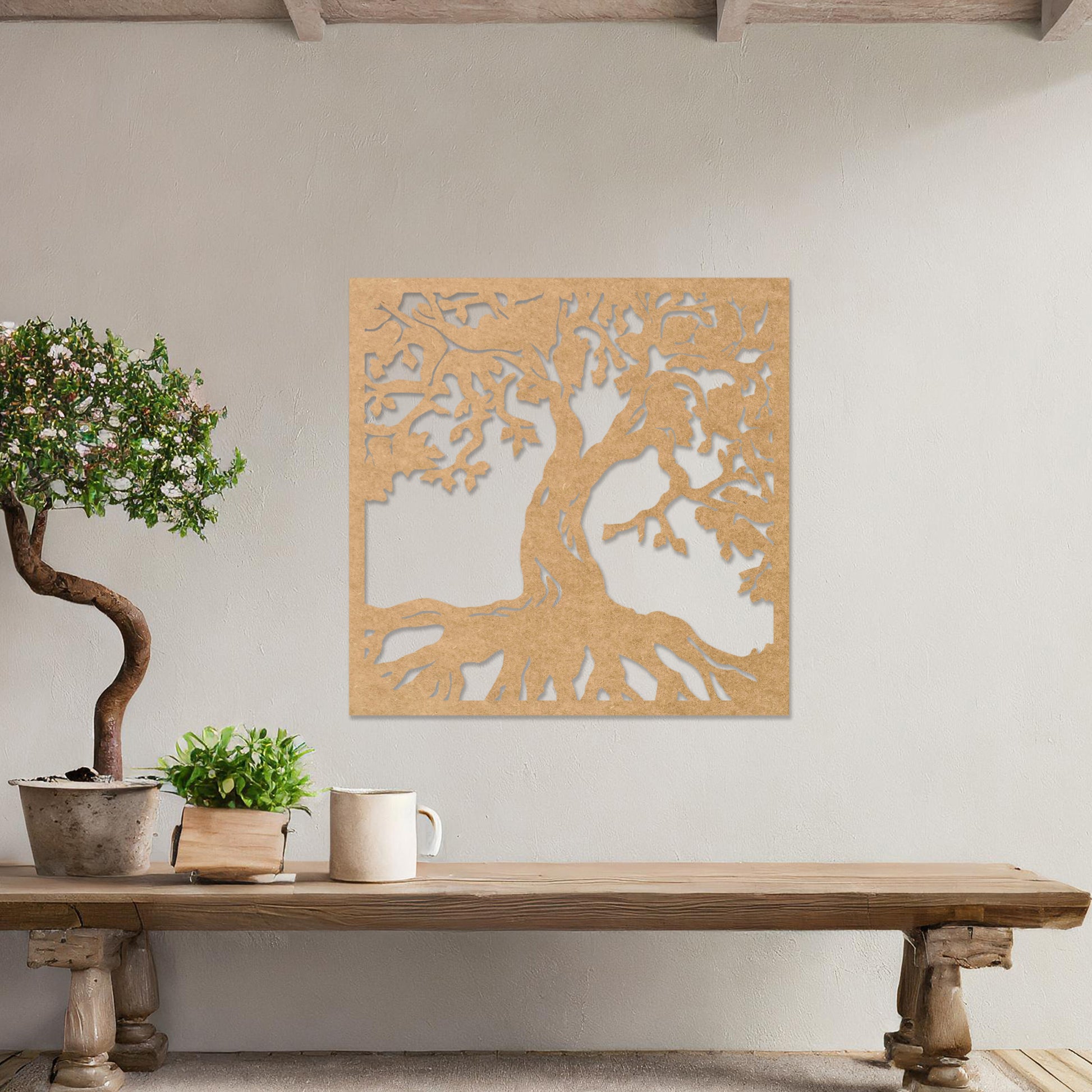 Wall art featuring a detailed tree of life design with sprawling branches and roots, symbolising growth and connection. The piece is displayed on a neutral wall within rustic-modern decor, adding a natural and meaningful focal point to the space.