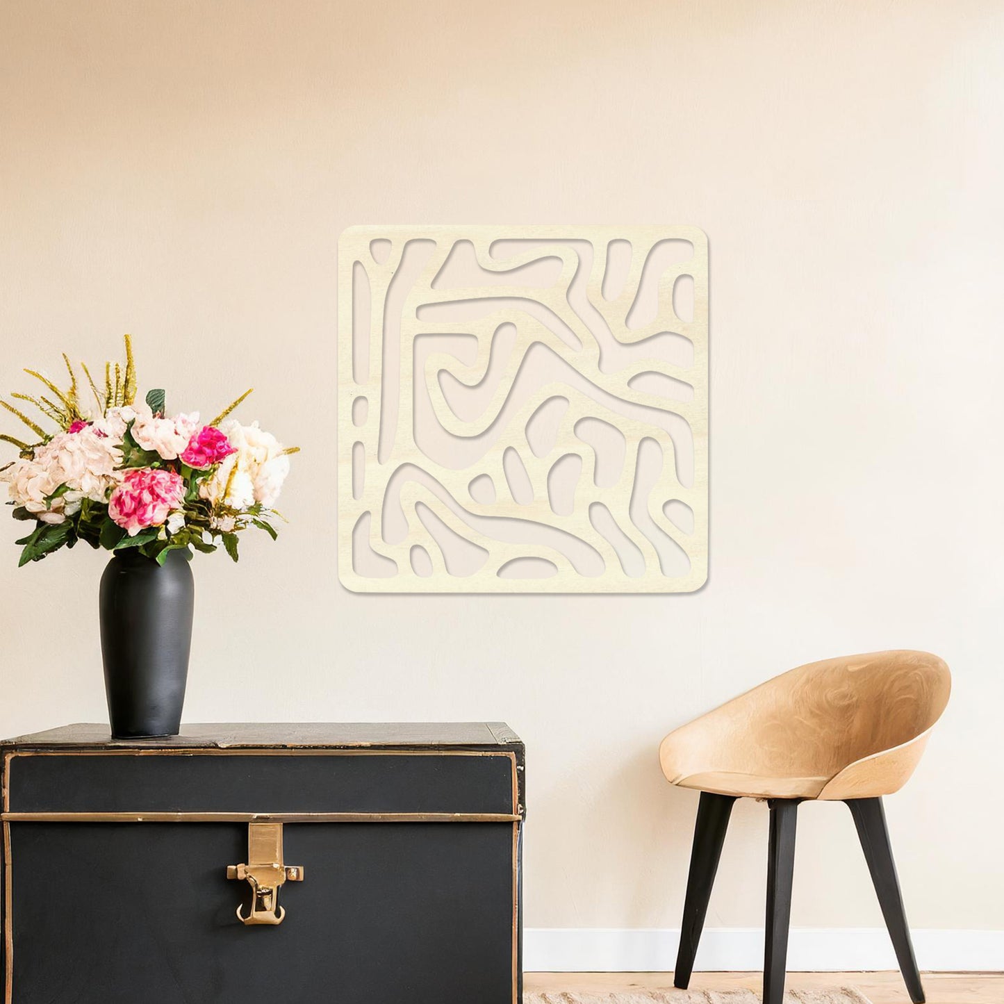 Wall art featuring an abstract design with flowing, interconnected organic shapes forming a bold pattern. The piece is displayed on a neutral wall within modern decor, adding a contemporary and artistic touch to the space.