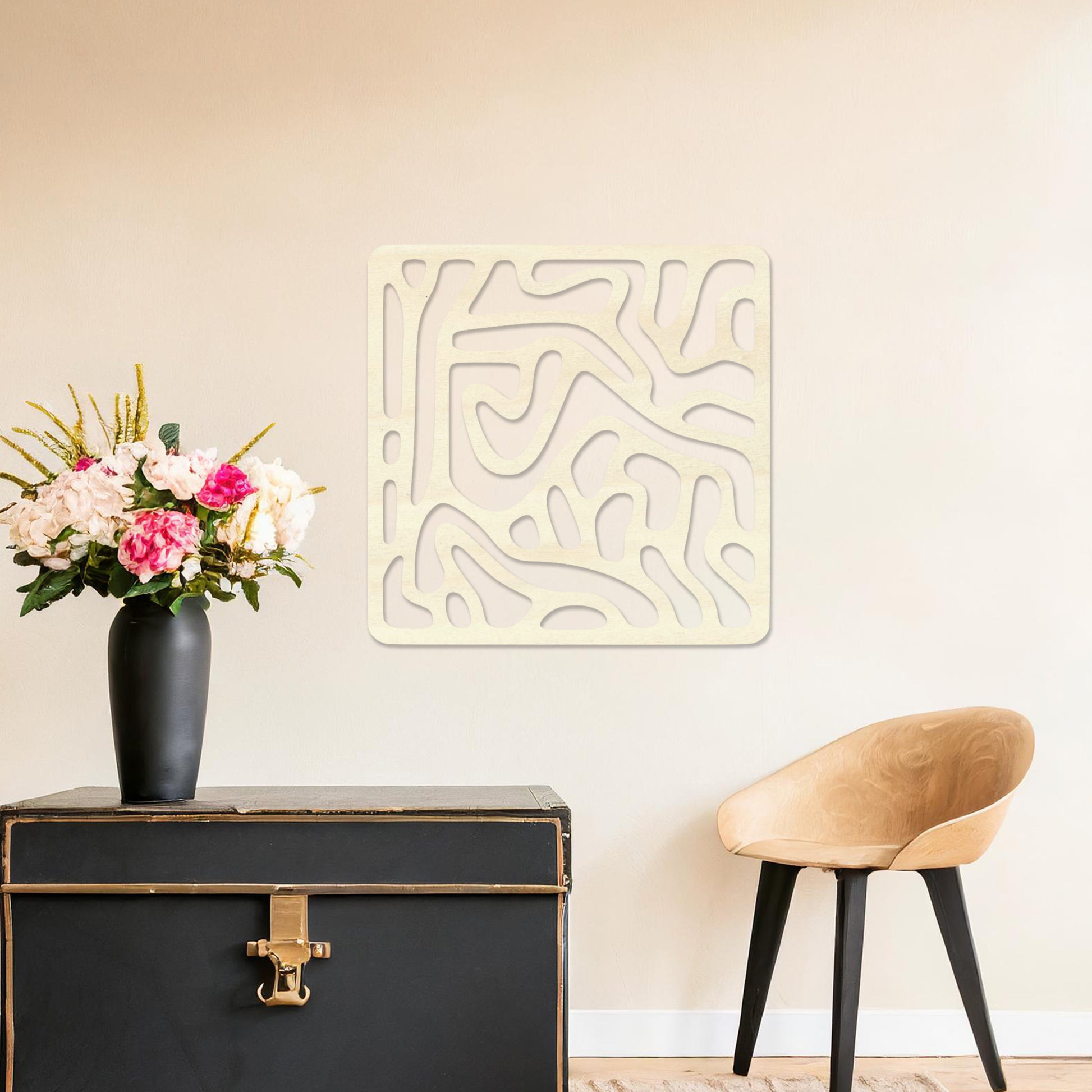 Wall art featuring an abstract design with flowing, interconnected organic shapes forming a bold pattern. The piece is displayed on a neutral wall within modern decor, adding a contemporary and artistic touch to the space.