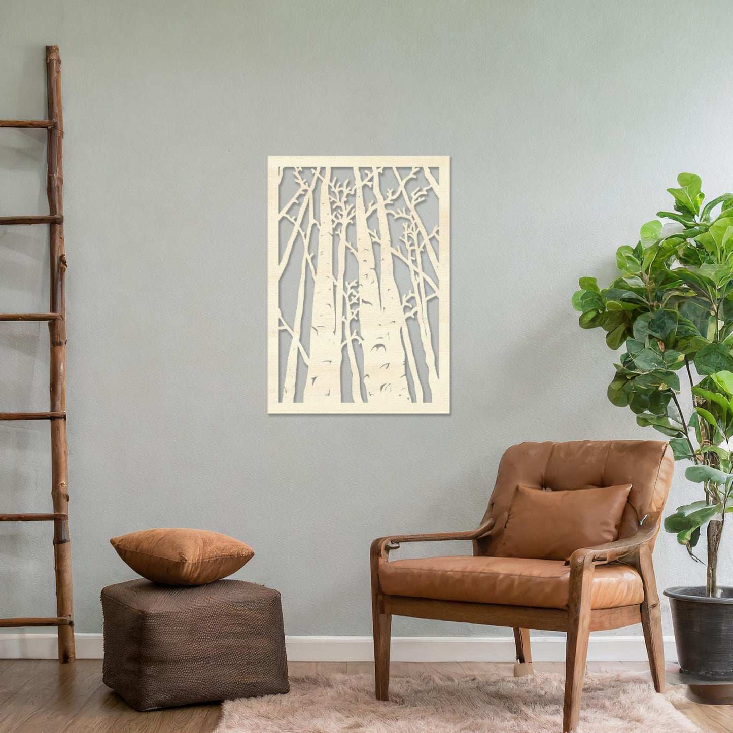 Wooden wall art featuring a forest design with tall, slender trees and intricate branches, displayed on a neutral wall within modern room decor, showcasing its natural and artistic craftsmanship.