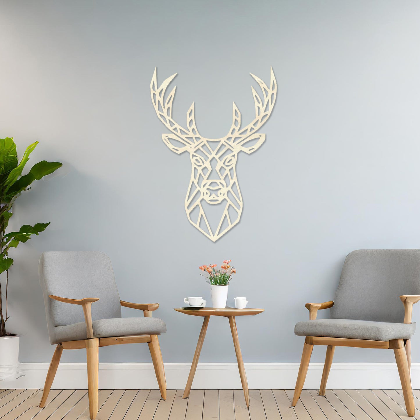 Wooden wall art featuring a geometric deer head design with intricate antlers, displayed on a neutral wall within modern room decor, showcasing its bold and contemporary artistic style.