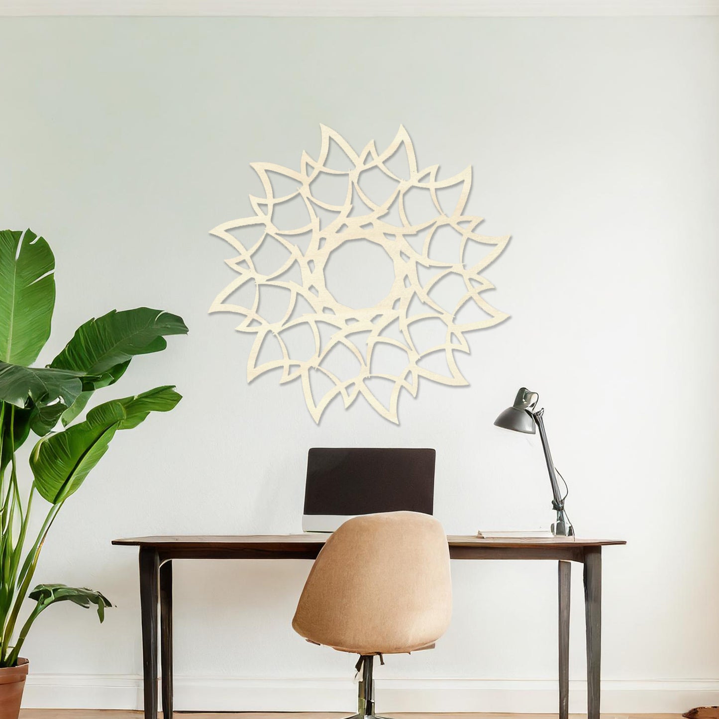 Wooden wall art featuring a circular mandala-inspired design with intricate petal-like patterns, displayed on a neutral wall within modern room decor, showcasing its elegant and detailed craftsmanship.