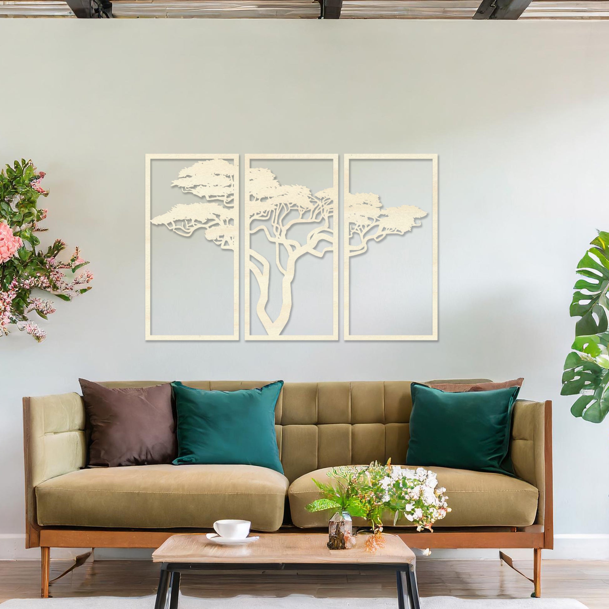 Three-panel wooden wall art featuring an elegant silhouette of a tree with spreading branches, displayed on a neutral wall within modern room decor. The intricate design adds depth and sophistication to the space.