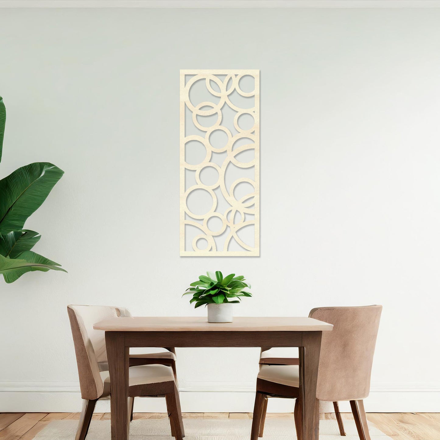 A rectangular wall art piece featuring an abstract design of overlapping circles of various sizes. The artwork is displayed on a neutral wall in a modern room,