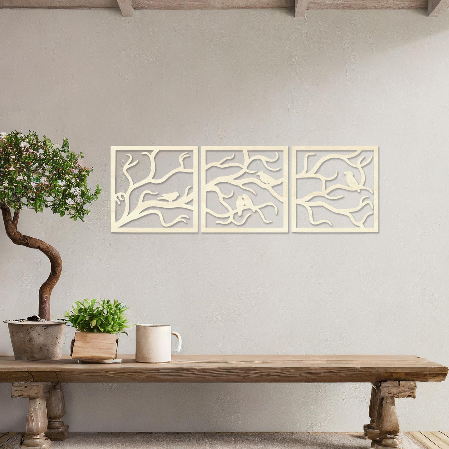 A three-panel wall art showcasing a design of birds perched on delicate tree branches. The intricate artwork is displayed on a neutral wall in a modern room, enhancing the natural and elegant ambiance of the decor.