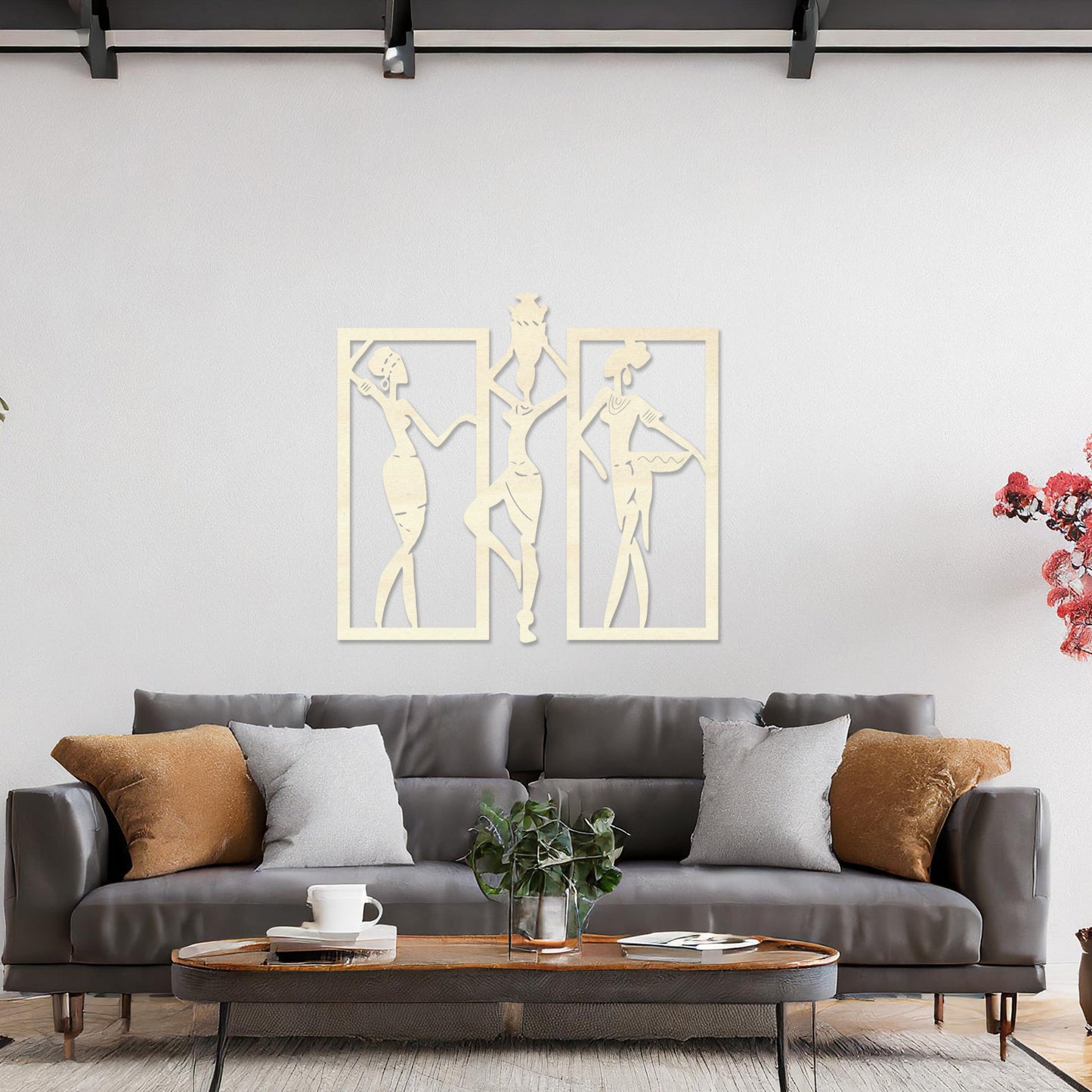 Wall art featuring a triptych design of abstract figures in dynamic poses, framed within rectangular panels. The artwork is displayed on a neutral wall within modern decor, adding an artistic and cultural touch to the space.