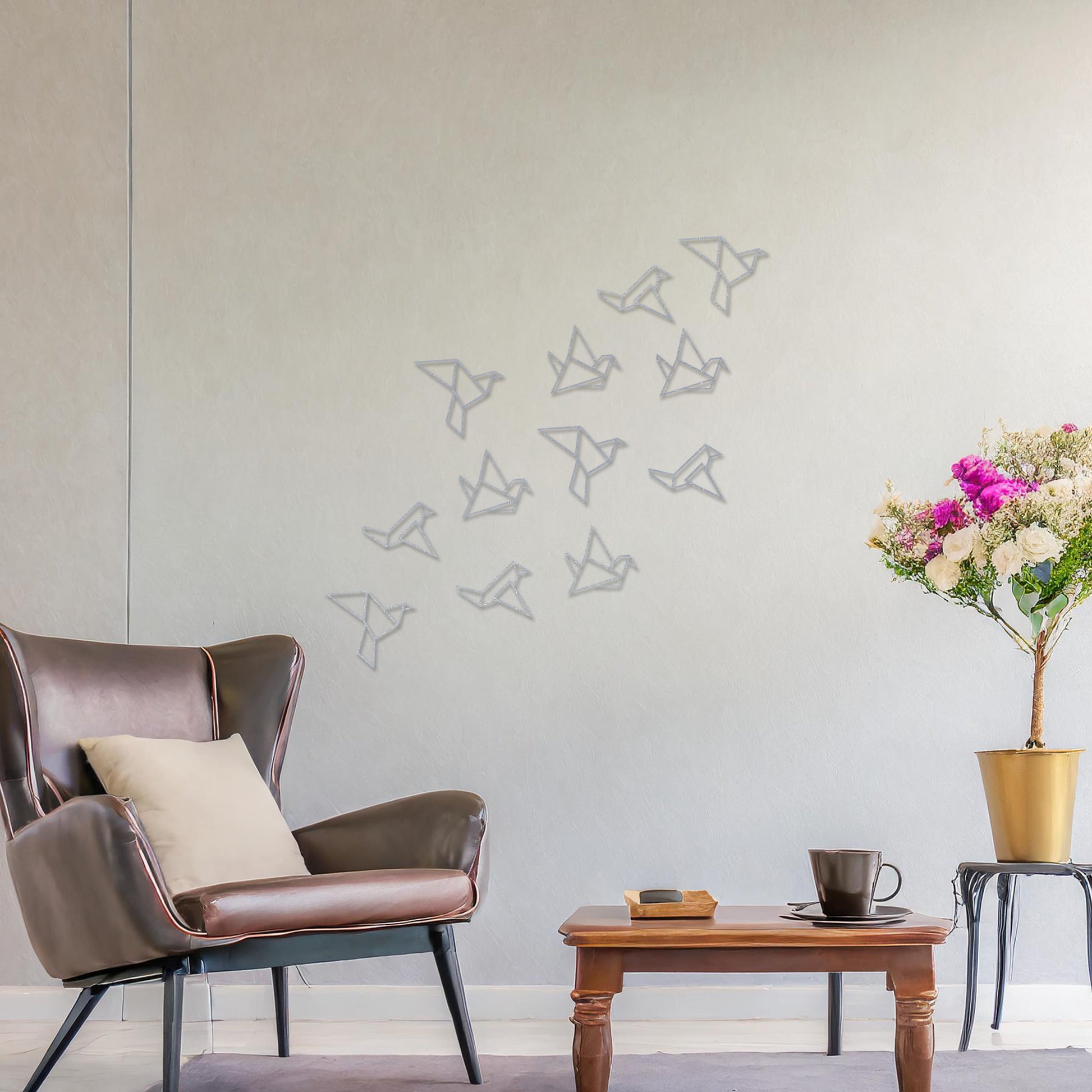 Wooden wall art featuring a flock of geometric bird designs in a scattered arrangement, creating a sense of movement. The artwork is displayed on a neutral wall within modern room decor, highlighting its dynamic and minimalist aesthetic.