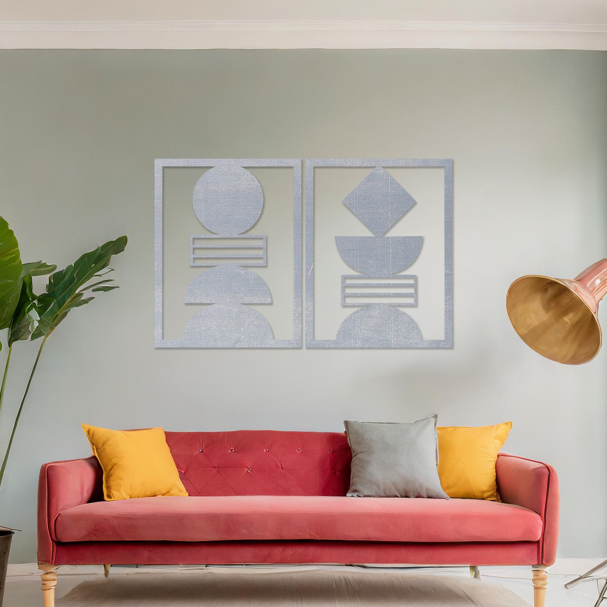 Wall art featuring a set of two geometric abstract designs, each framed with symmetrical shapes and minimalist patterns. The pieces are displayed on a neutral wall within modern room decor, enhancing the contemporary aesthetic.