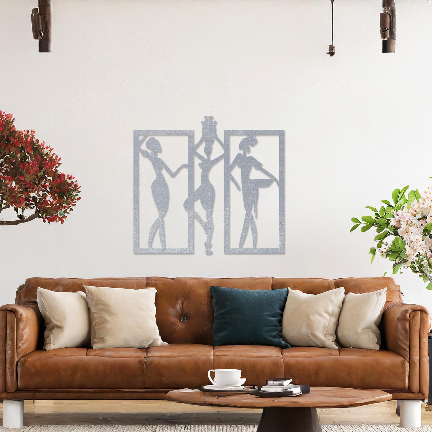 Wall art featuring a triptych design of abstract figures in dynamic poses, framed within rectangular panels. The artwork is displayed on a neutral wall within modern decor, adding an artistic and cultural touch to the space.
