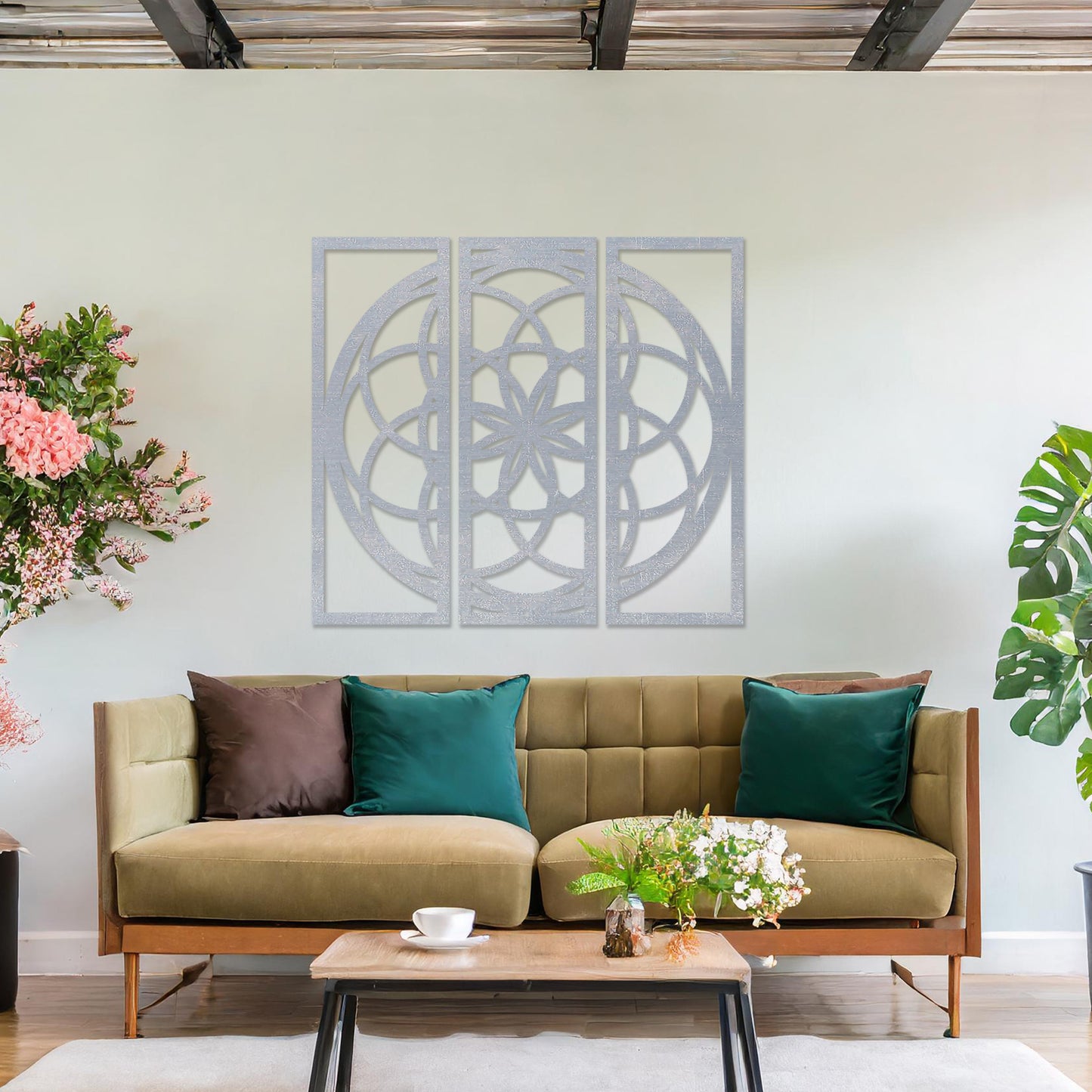 Wall art featuring a triptych design with an intricate geometric pattern of interlocking circles and floral elements. The artwork is displayed on a neutral wall within modern decor, adding a balanced and artistic focal point to the space.