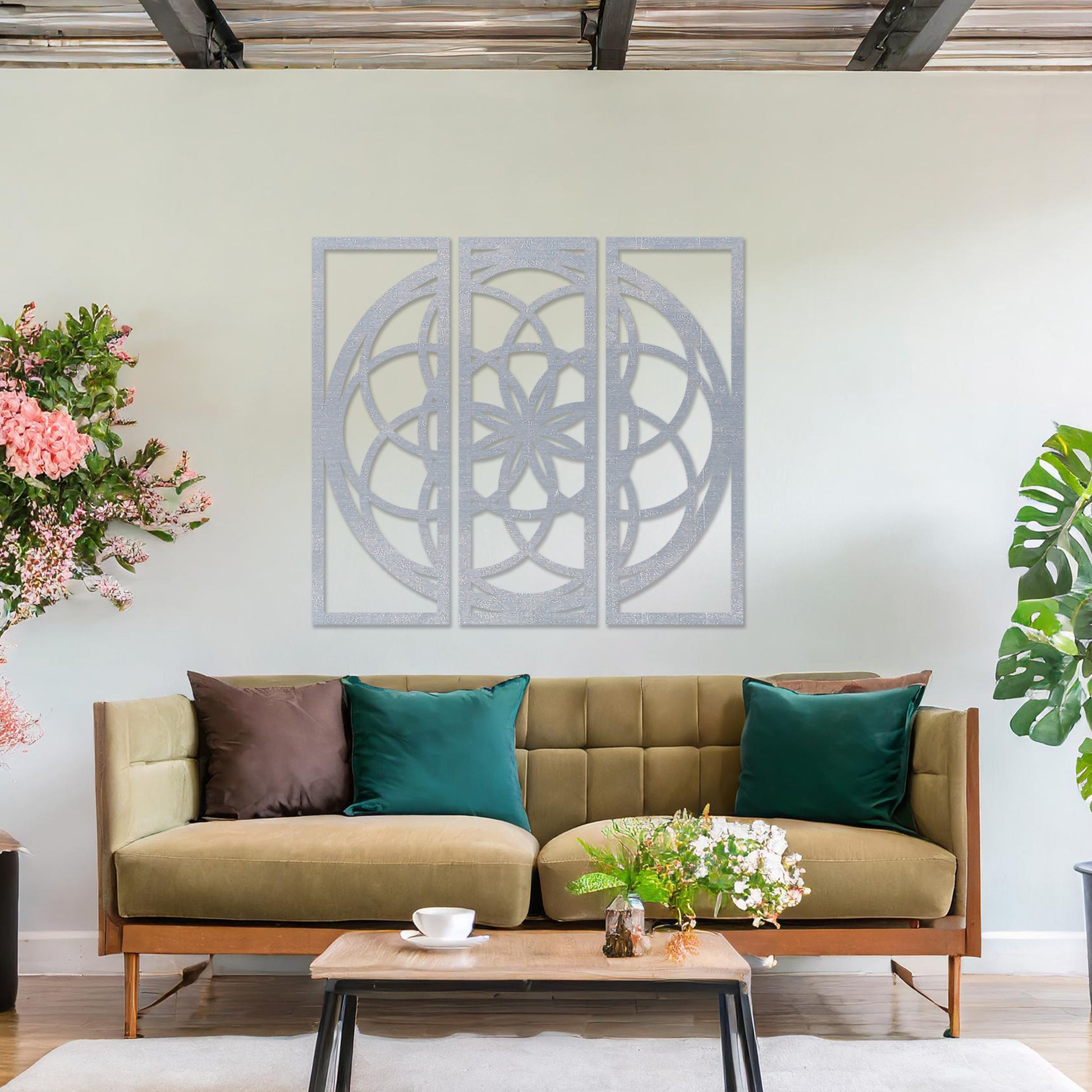 Wall art featuring a triptych design with an intricate geometric pattern of interlocking circles and floral elements. The artwork is displayed on a neutral wall within modern decor, adding a balanced and artistic focal point to the space.