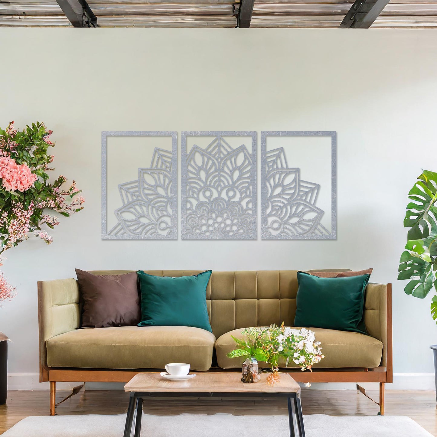 Wall art featuring a triptych design with an intricate mandala pattern spread across three panels. The artwork is displayed on a neutral wall within modern room decor, adding a harmonious and decorative touch to the setting.