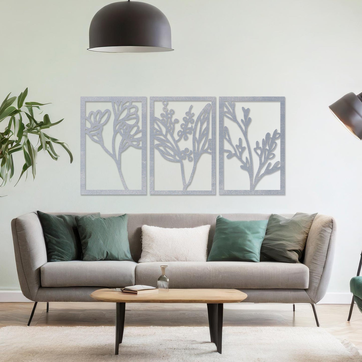 Wall art featuring a triptych of minimalist botanical designs, each panel highlighting delicate stems, leaves, and berries. The artwork is displayed on a neutral wall within modern decor, adding a subtle and natural elegance to the space.