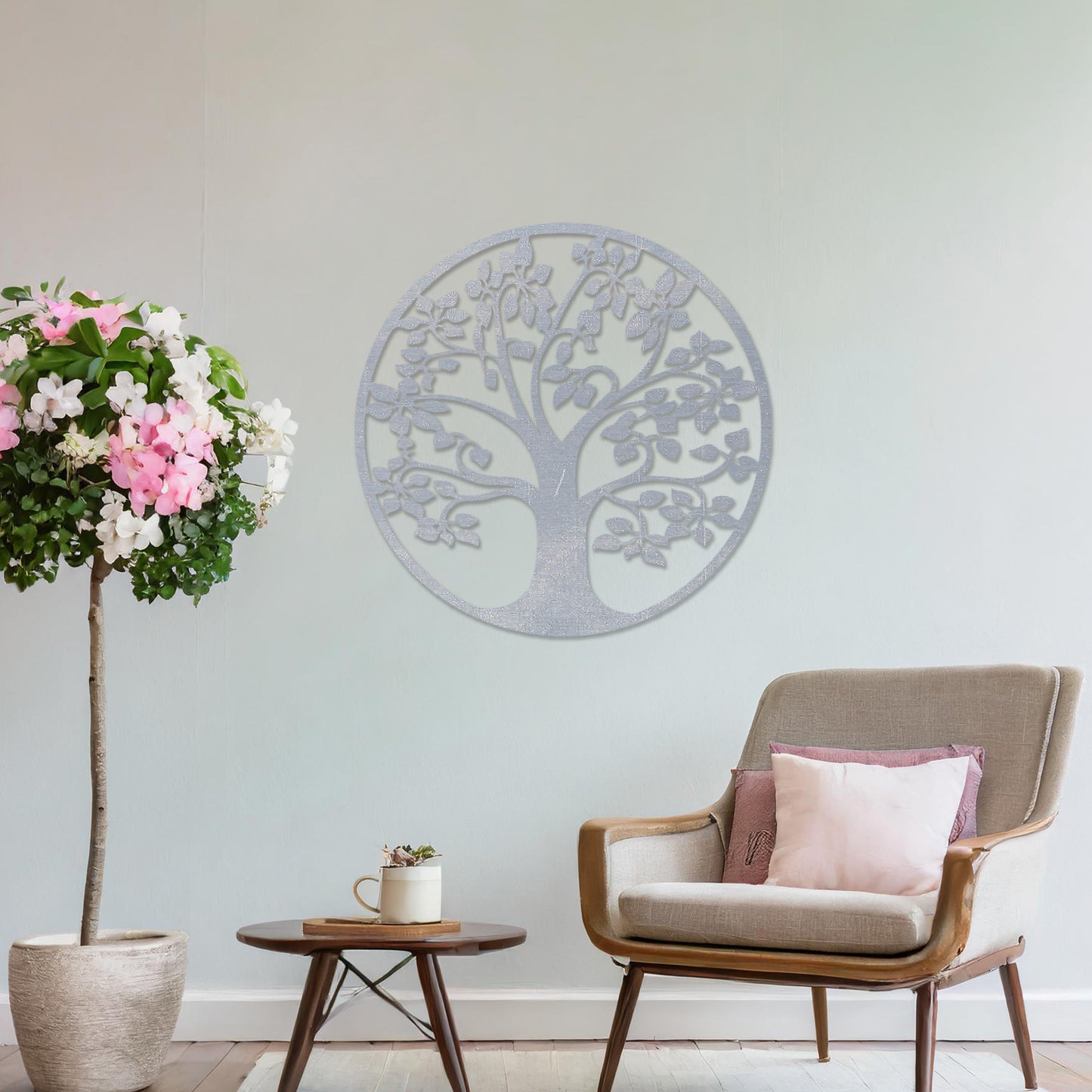 Wooden wall art featuring a circular tree design with detailed leaves and branches, displayed on a neutral wall within modern room decor, emphasising its natural elegance and intricate craftsmanship.