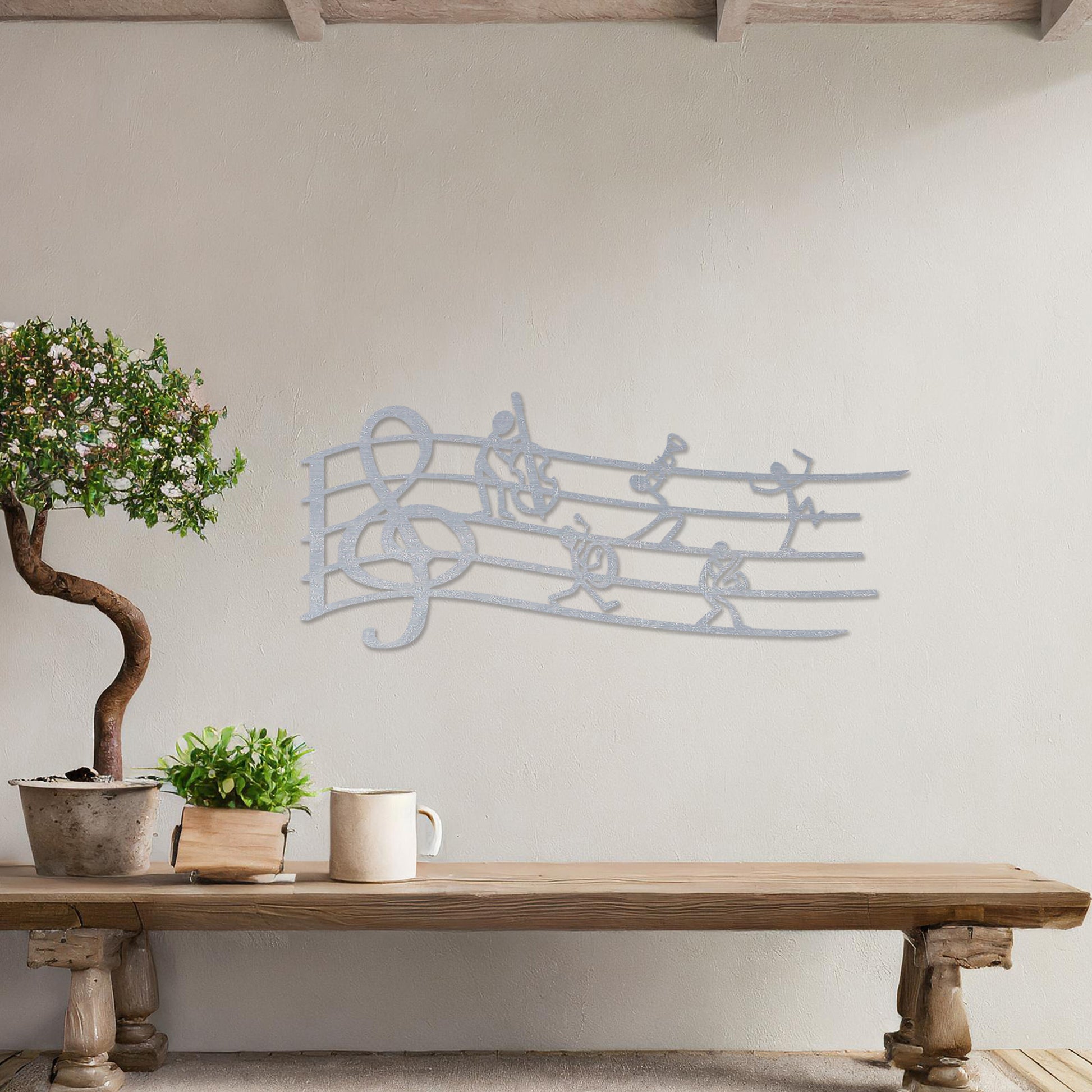 Wall art featuring a creative design of a musical staff with a treble clef and stick figures playing instruments, adding a whimsical and artistic touch. The piece is displayed on a neutral wall within modern decor, enhancing the space with musical charm.