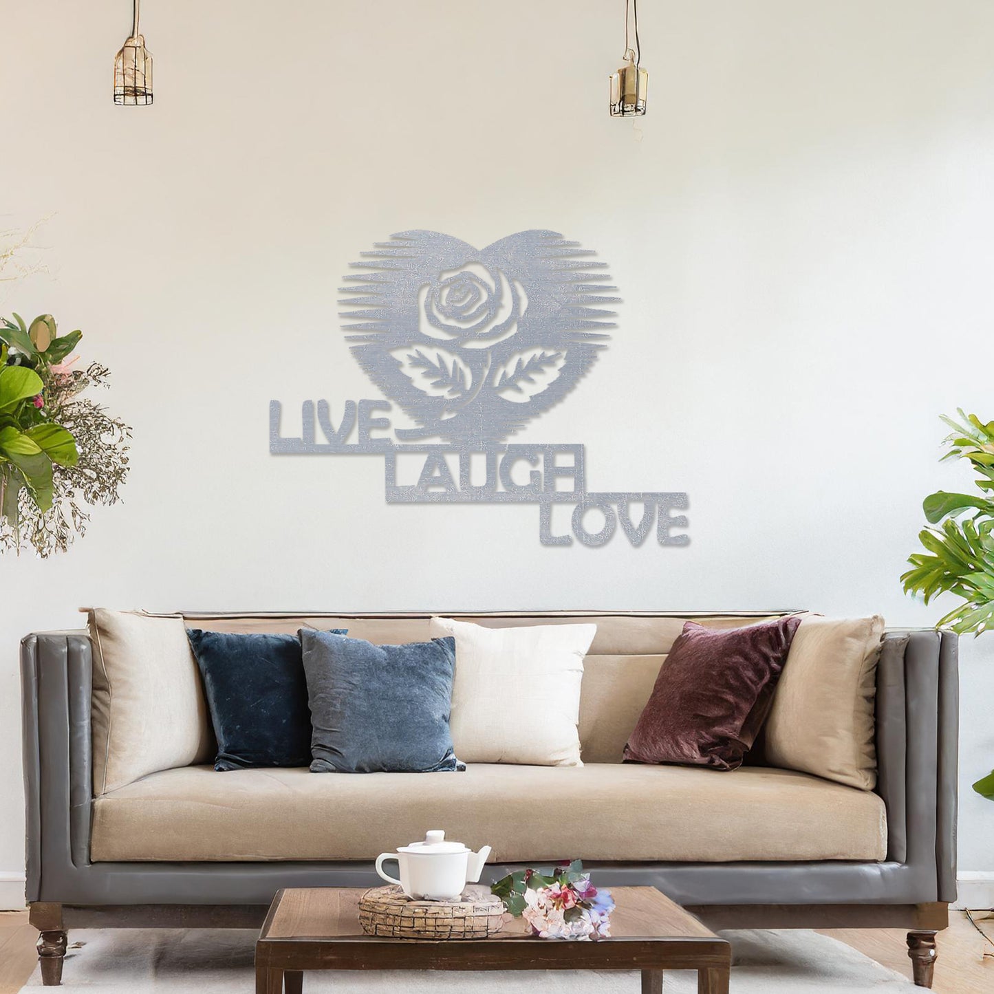 The design features the phrase "LIVE LAUGH LOVE" arranged in a staggered layout, with a rose inside a heart shape above the text. The clean, geometric lines of the text and the heart-shaped rose create a striking, modern look.