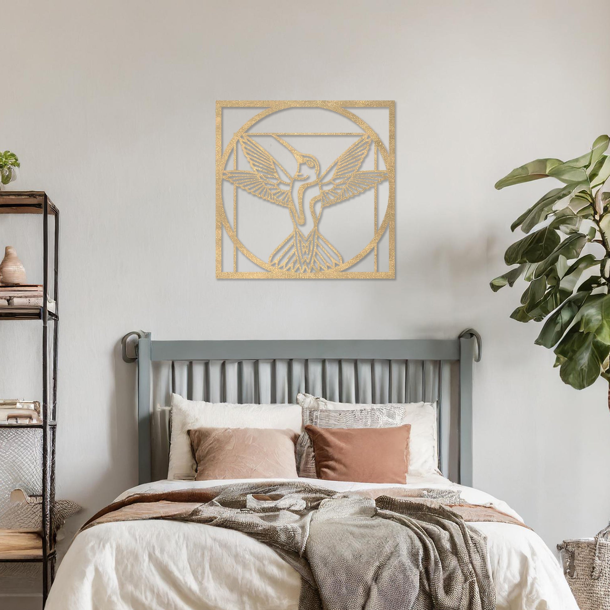 Wooden hummingbird wall art showcasing a detailed design with outstretched wings in a geometric frame, placed on a neutral wall within modern room decor, adding a touch of elegance and nature-inspired artistry to the space.