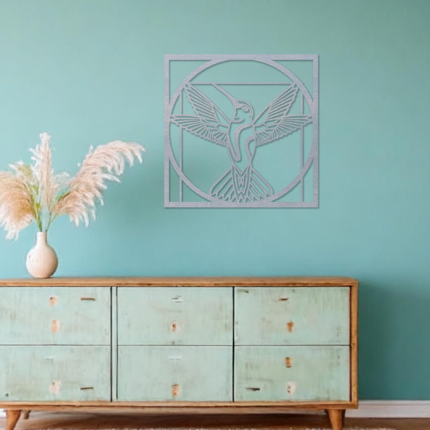 Wooden hummingbird wall art showcasing a detailed design with outstretched wings in a geometric frame, placed on a neutral wall within modern room decor, adding a touch of elegance and nature-inspired artistry to the space.