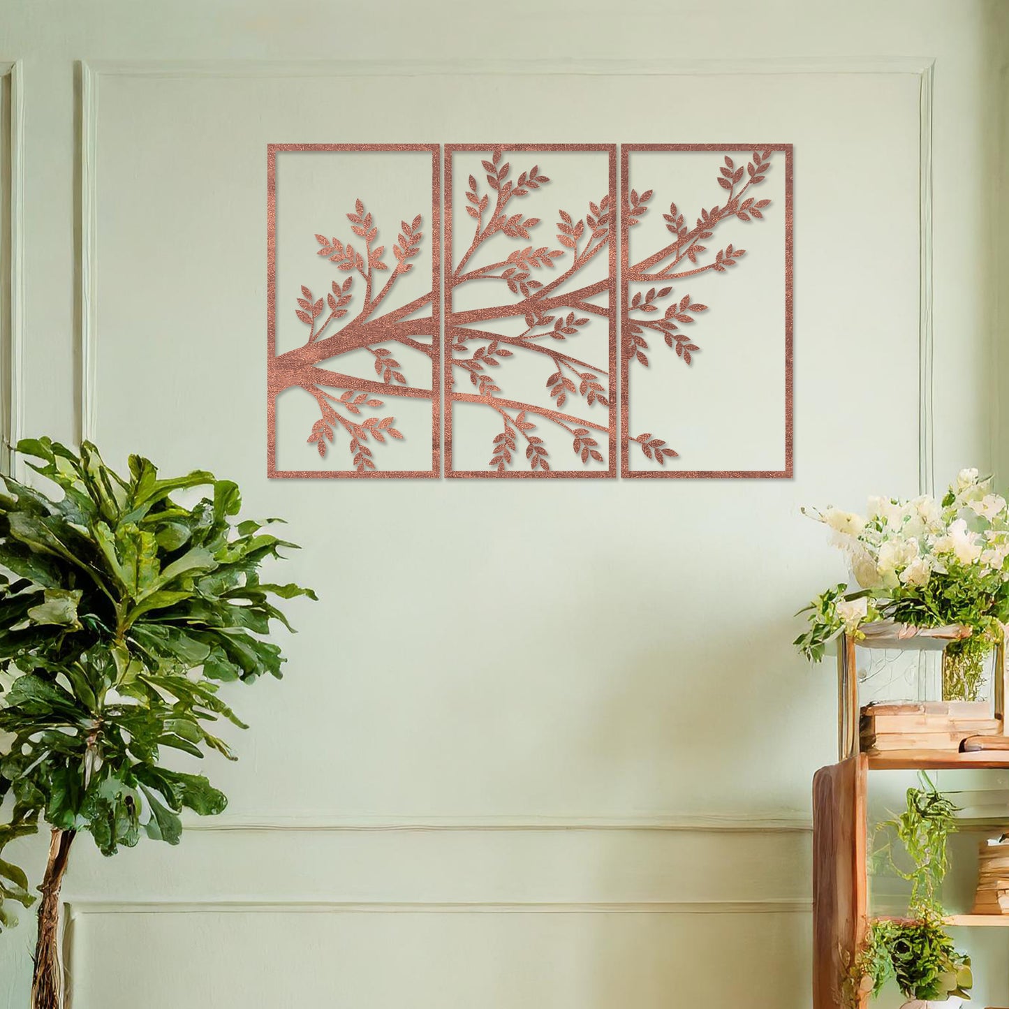 Wooden wall art featuring a three-panel design of a branching tree with delicate leaves extending gracefully across each panel. Mounted on a neutral wall within modern decor, this piece evokes a sense of natural elegance and harmony.