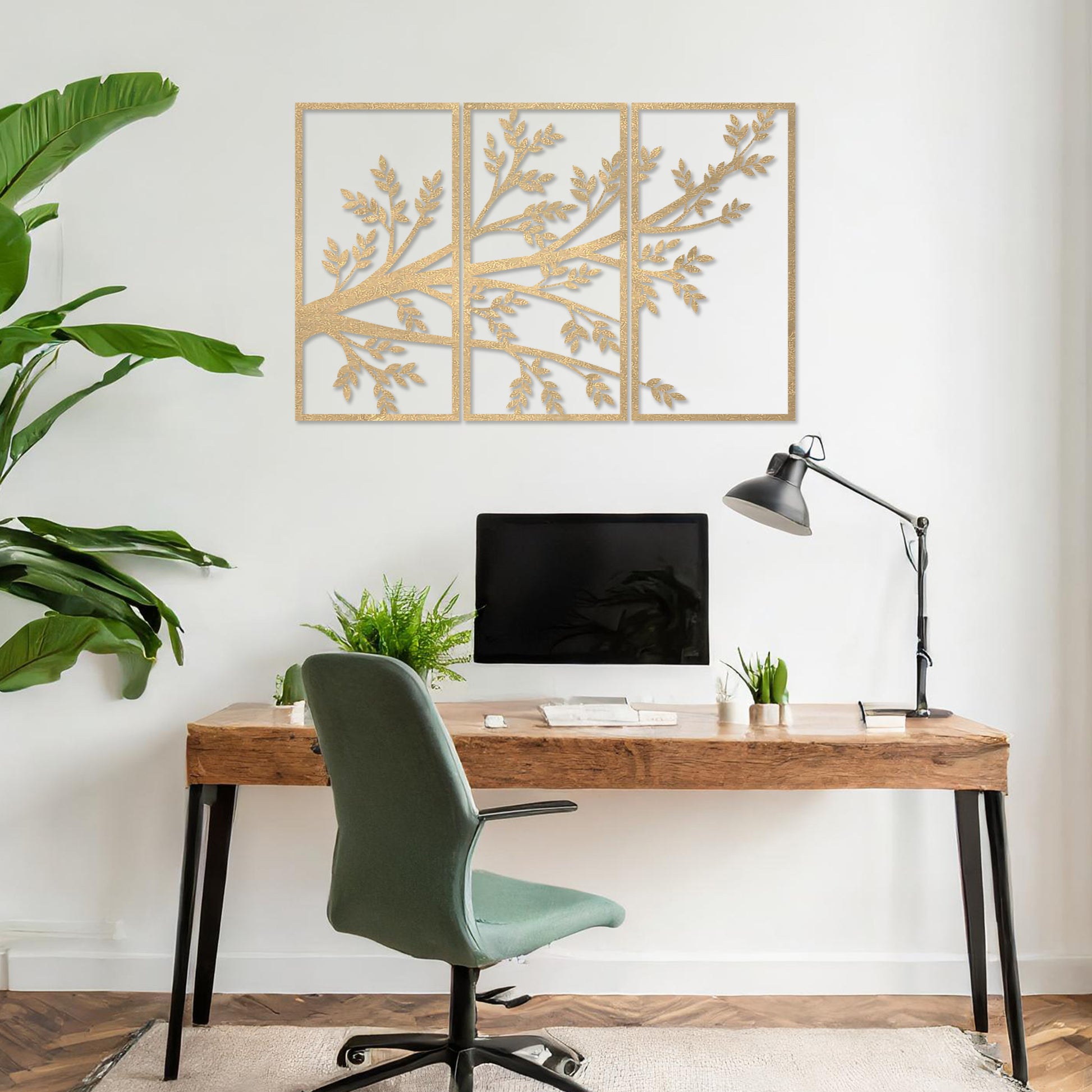 Wooden wall art featuring a three-panel design of a branching tree with delicate leaves extending gracefully across each panel. Mounted on a neutral wall within modern decor, this piece evokes a sense of natural elegance and harmony.