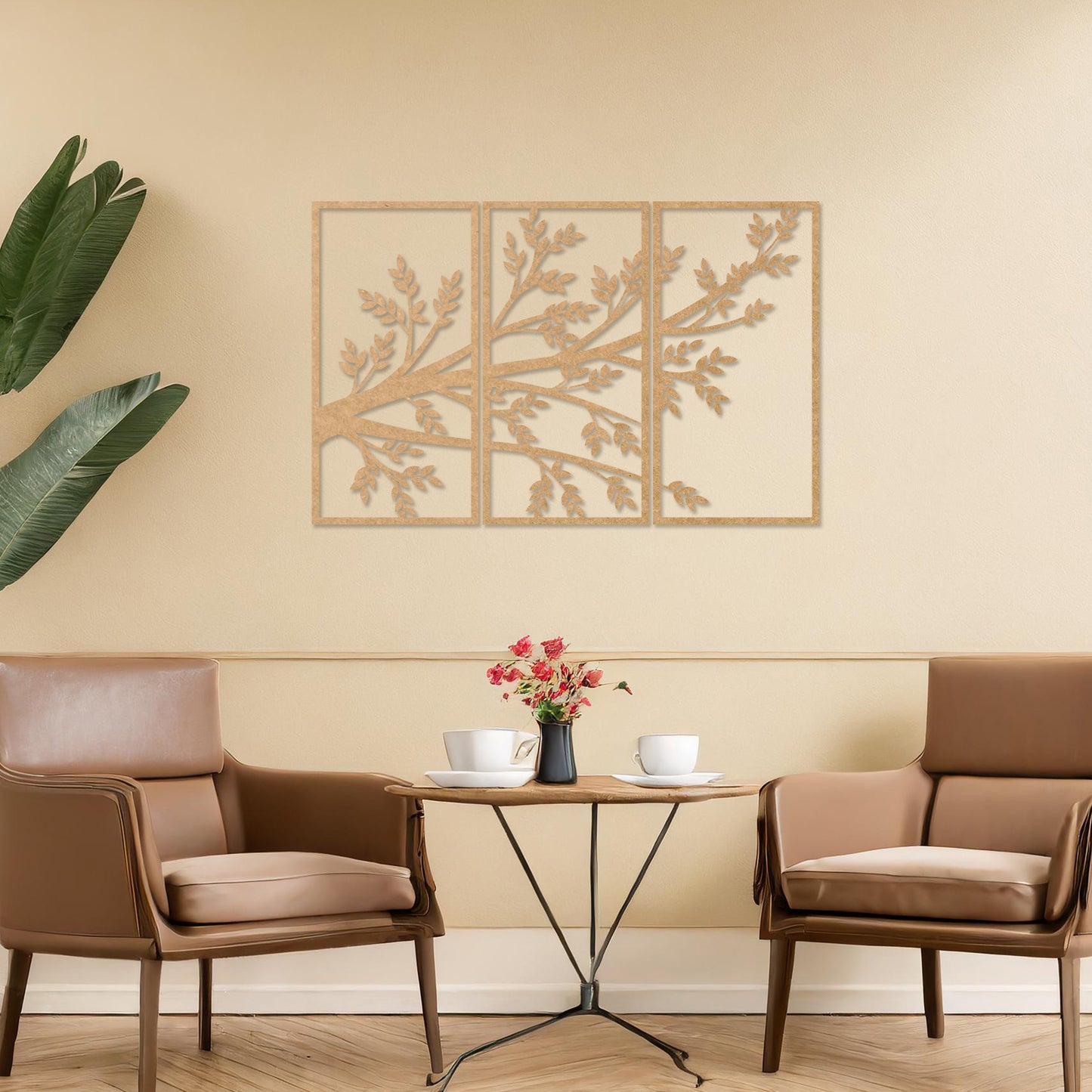 Wooden wall art featuring a three-panel design of a branching tree with delicate leaves extending gracefully across each panel. Mounted on a neutral wall within modern decor, this piece evokes a sense of natural elegance and harmony.