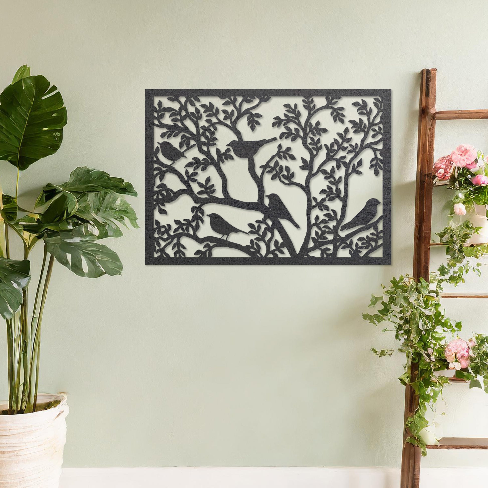 Wooden wall art showcasing a detailed scene of birds perched on intricately designed tree branches. The design highlights nature's charm, placed on a neutral wall within modern room decor, creating an inviting and tranquil atmosphere.