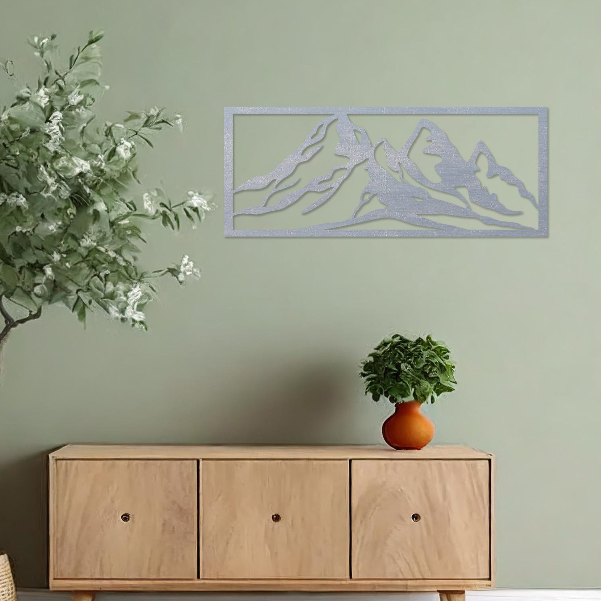 Wooden wall art featuring a stunning mountain range design, capturing the essence of natural landscapes. Set against a neutral wall in a modern decor setting, this artwork adds depth and serenity to the room's atmosphere.