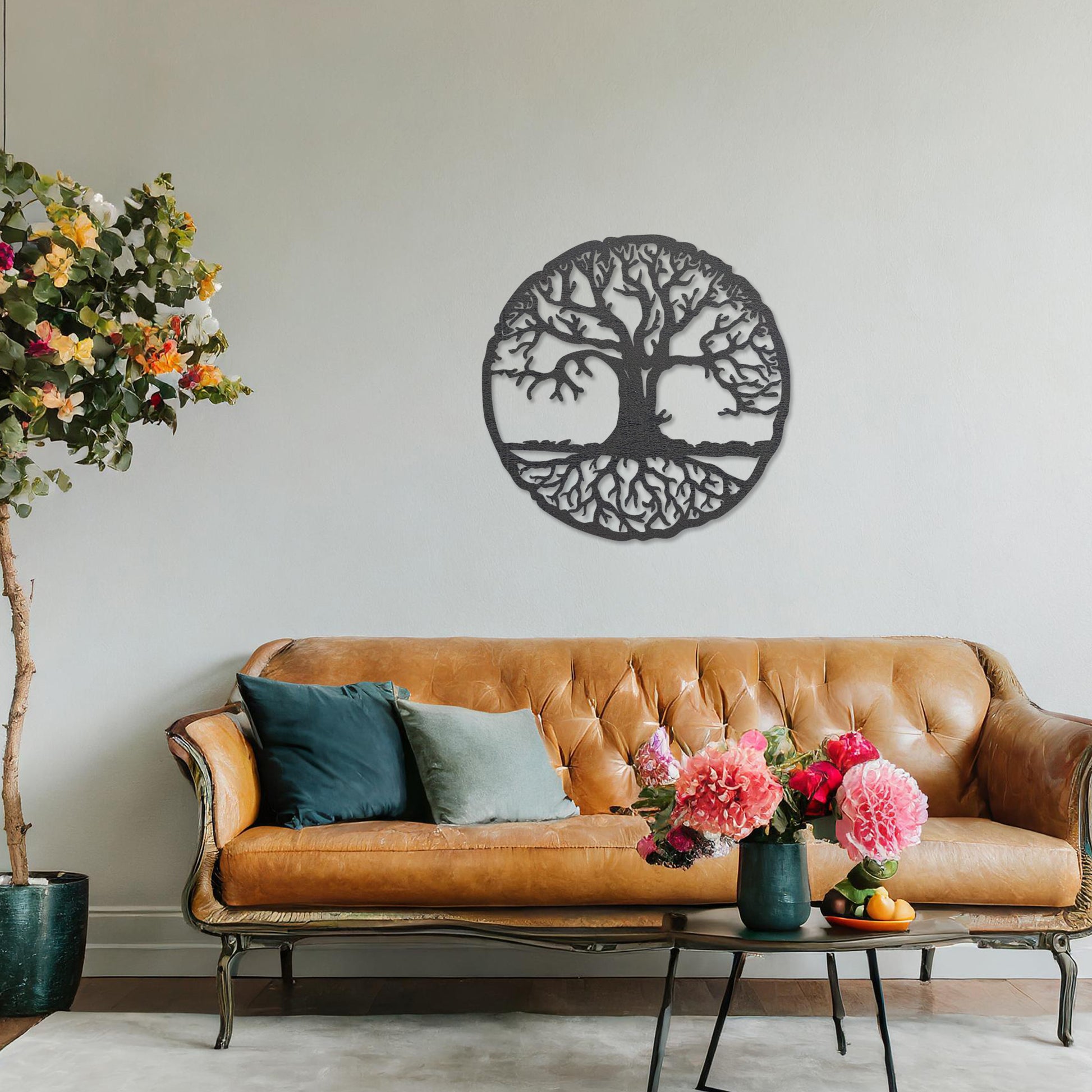 Round wooden wall art featuring an intricate tree design with sprawling branches and roots, symbolising connection and growth. Placed on a neutral wall in a modern room decor, this piece exudes a harmonious and earthy charm.