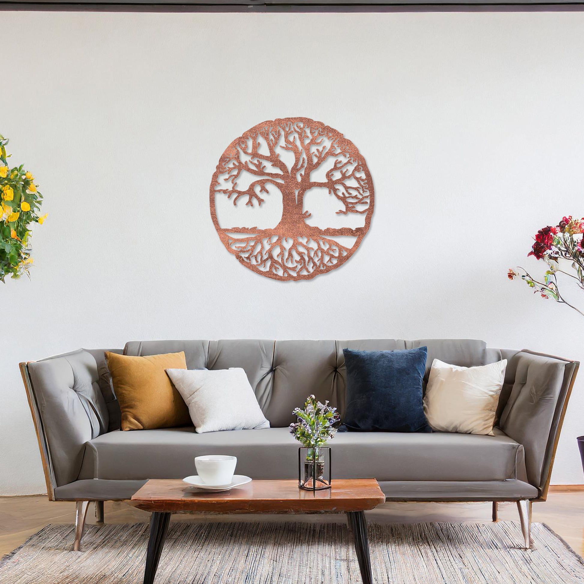 Round wooden wall art featuring an intricate tree design with sprawling branches and roots, symbolising connection and growth. Placed on a neutral wall in a modern room decor, this piece exudes a harmonious and earthy charm.