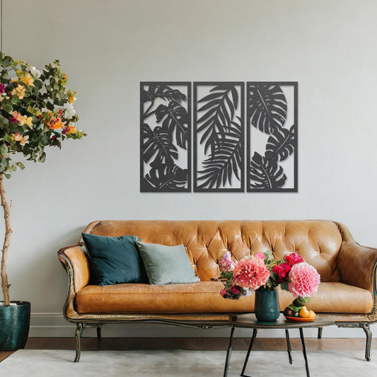 A set of three wooden wall panels featuring intricate tropical leaf designs, creating a cohesive and elegant decorative piece. Displayed on a neutral wall within modern room decor, this artwork brings a touch of nature indoors.