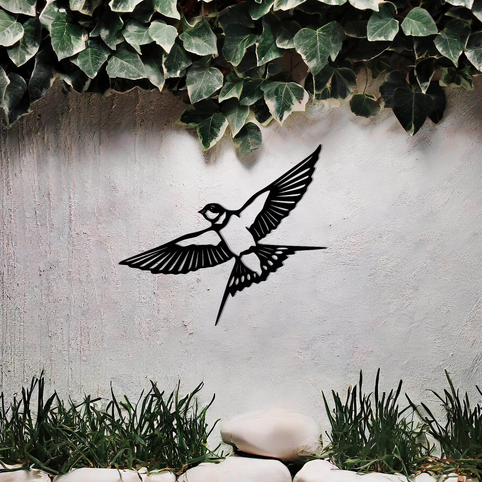 Metal garden decoration featuring a bird in mid-flight with detailed wings and tail, elegantly designed to bring a touch of nature-inspired charm and artistry to outdoor walls or garden settings.