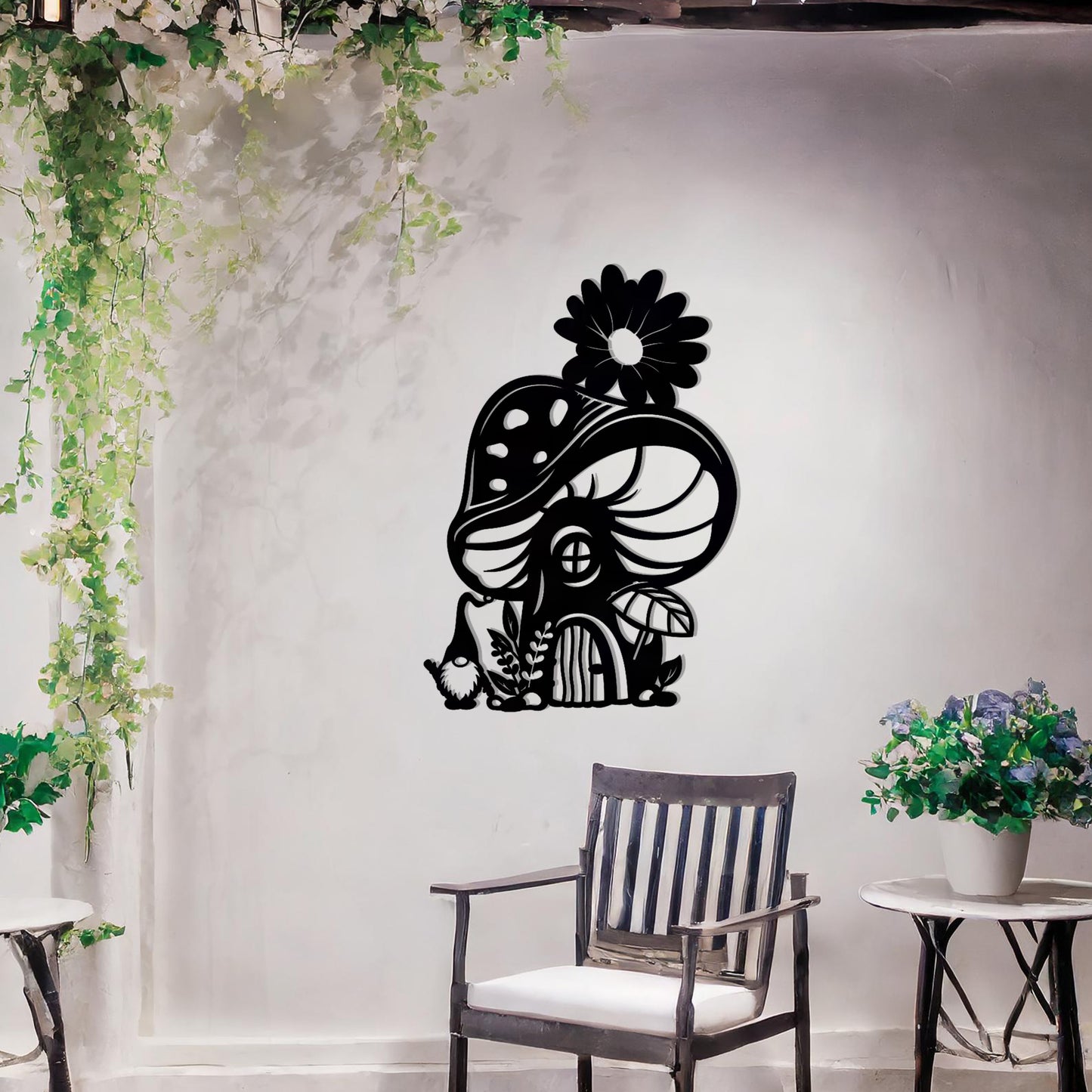 Metal garden decoration featuring a whimsical mushroom house adorned with floral and foliage details, crafted with intricate patterns, adding an enchanting and playful touch to outdoor or indoor spaces.