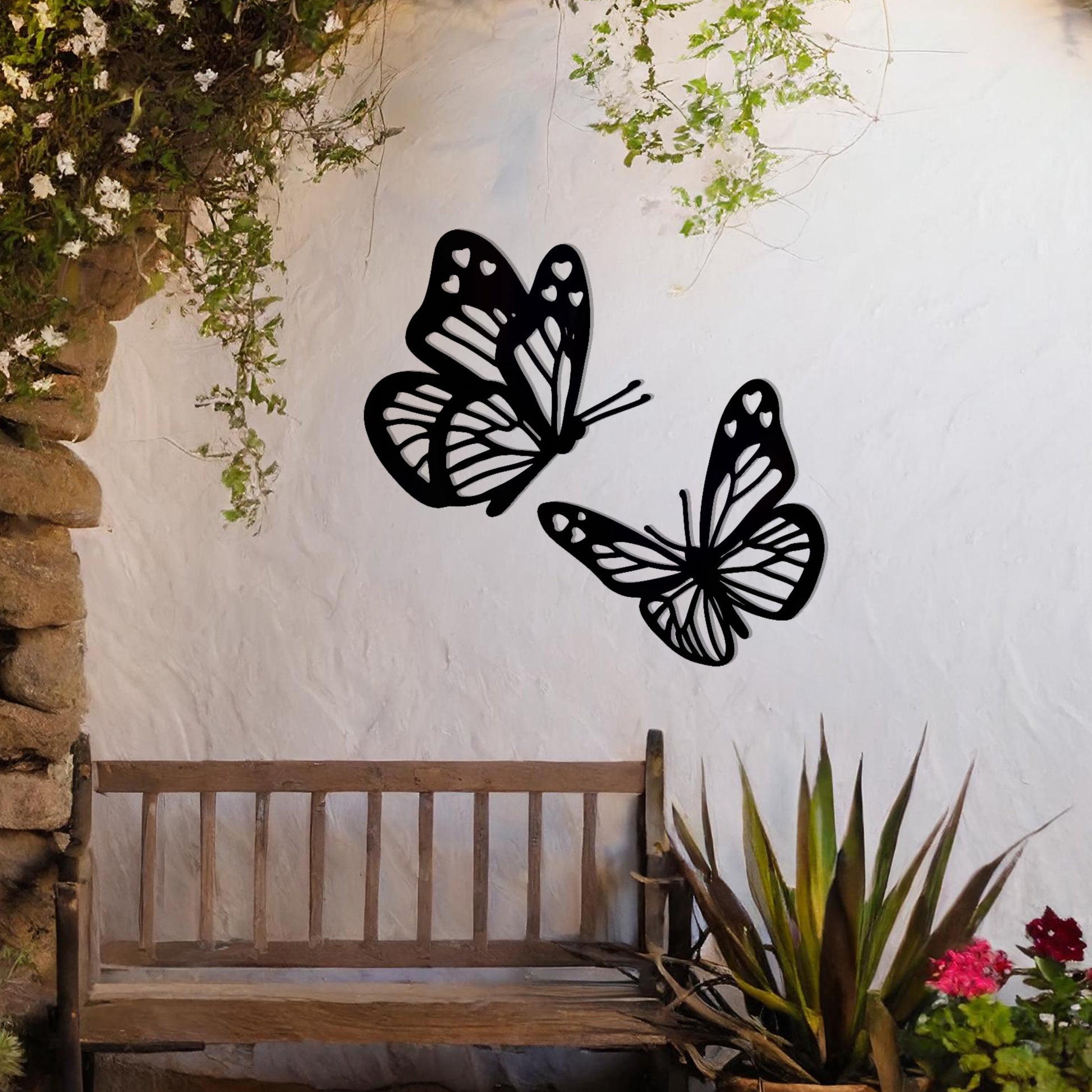 This design showcases a pair of intricately detailed butterflies in flight, their delicate wings adorned with heart-shaped accents. A charming addition to any space, celebrating the beauty of nature and the grace of butterflies.