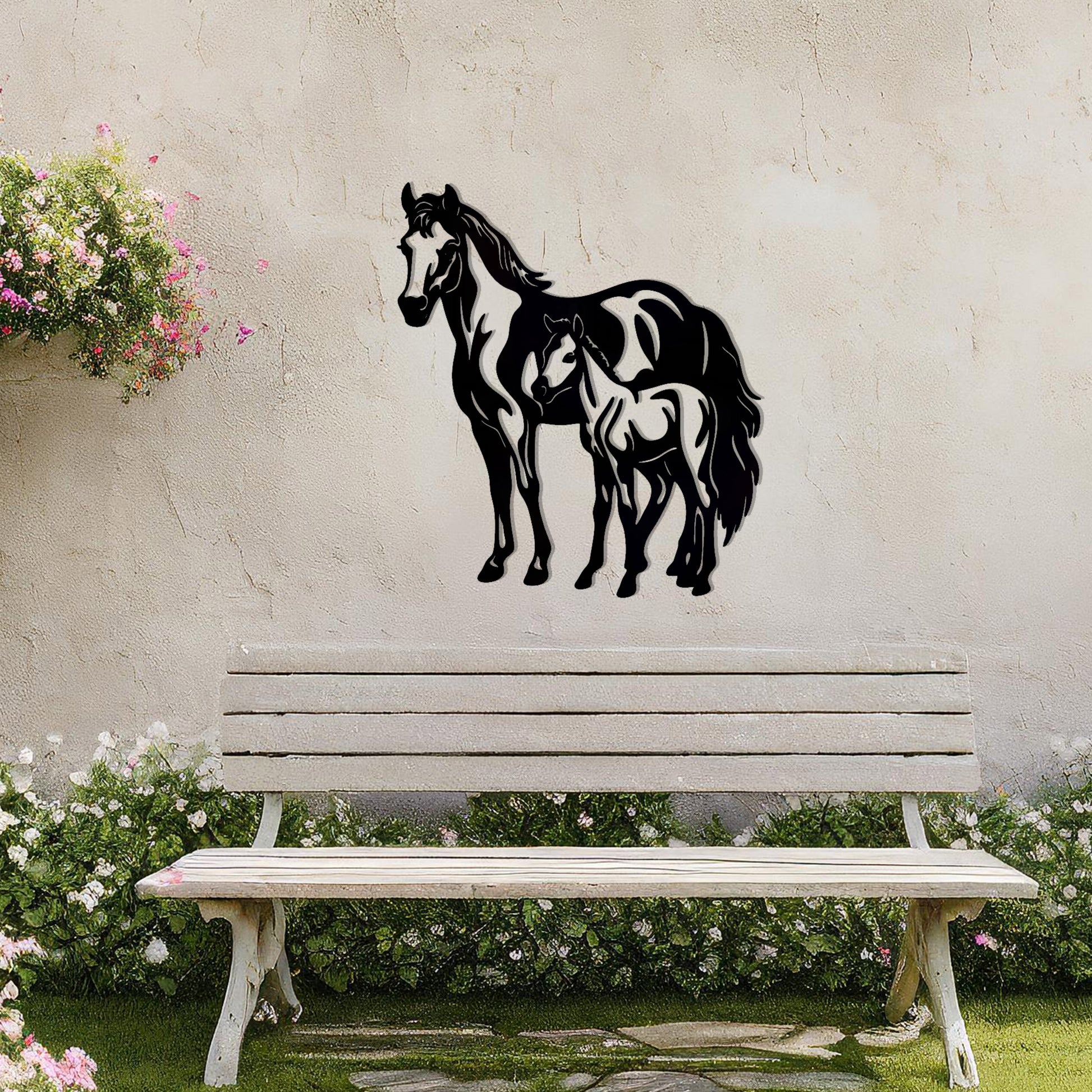 A stunning metal wall art design featuring two horses, showcasing a larger horse and a smaller one standing together, symbolising grace and unity. This artwork adds an elegant touch to a neutral wall in a beautifully styled outdoor space.