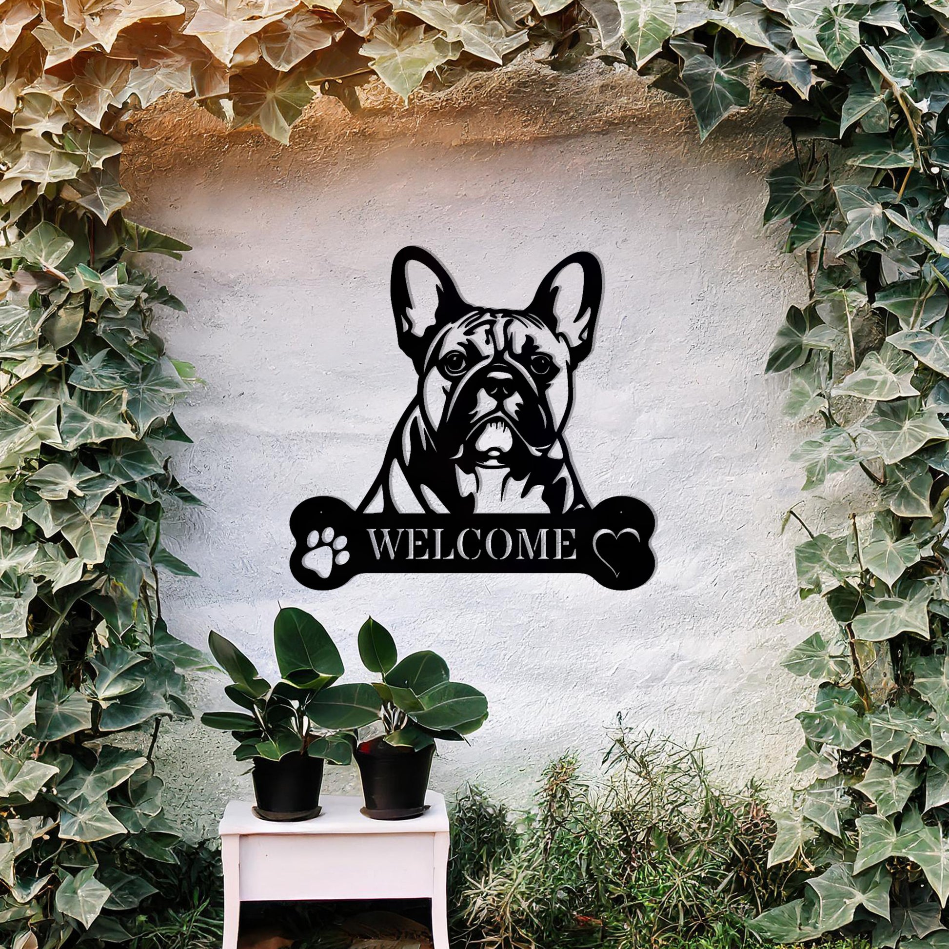 Metal French Bulldog design with a bone-shaped 'WELCOME' text and paw prints, perfect for adding a charming and welcoming touch to entryways or outdoor spaces.
