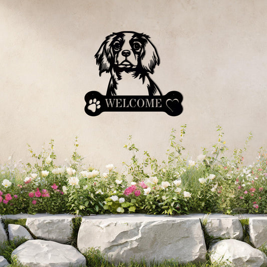 Metal Cavalier King Charles Spaniel dog design with a bone-shaped 'WELCOME' text and paw prints, perfect for adding a charming and welcoming touch to entryways or outdoor spaces.