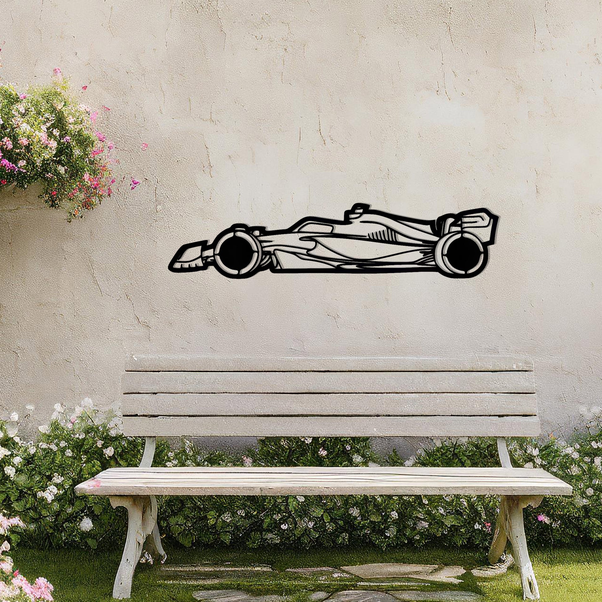 A sleek metal wall art design showcasing a detailed Formula 1 car silhouette. Perfect for motorsport enthusiasts, this artwork brings dynamic energy to modern or contemporary spaces. It is displayed on a neutral wall in a stylish outdoor setting.