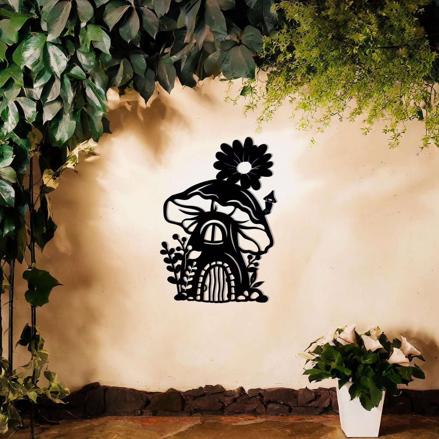 This piece depicts a whimsical mushroom house with a flower on top, surrounded by plants. Its enchanting design, perfect for garden or indoor decor, adds charm to any space with its delightful details.