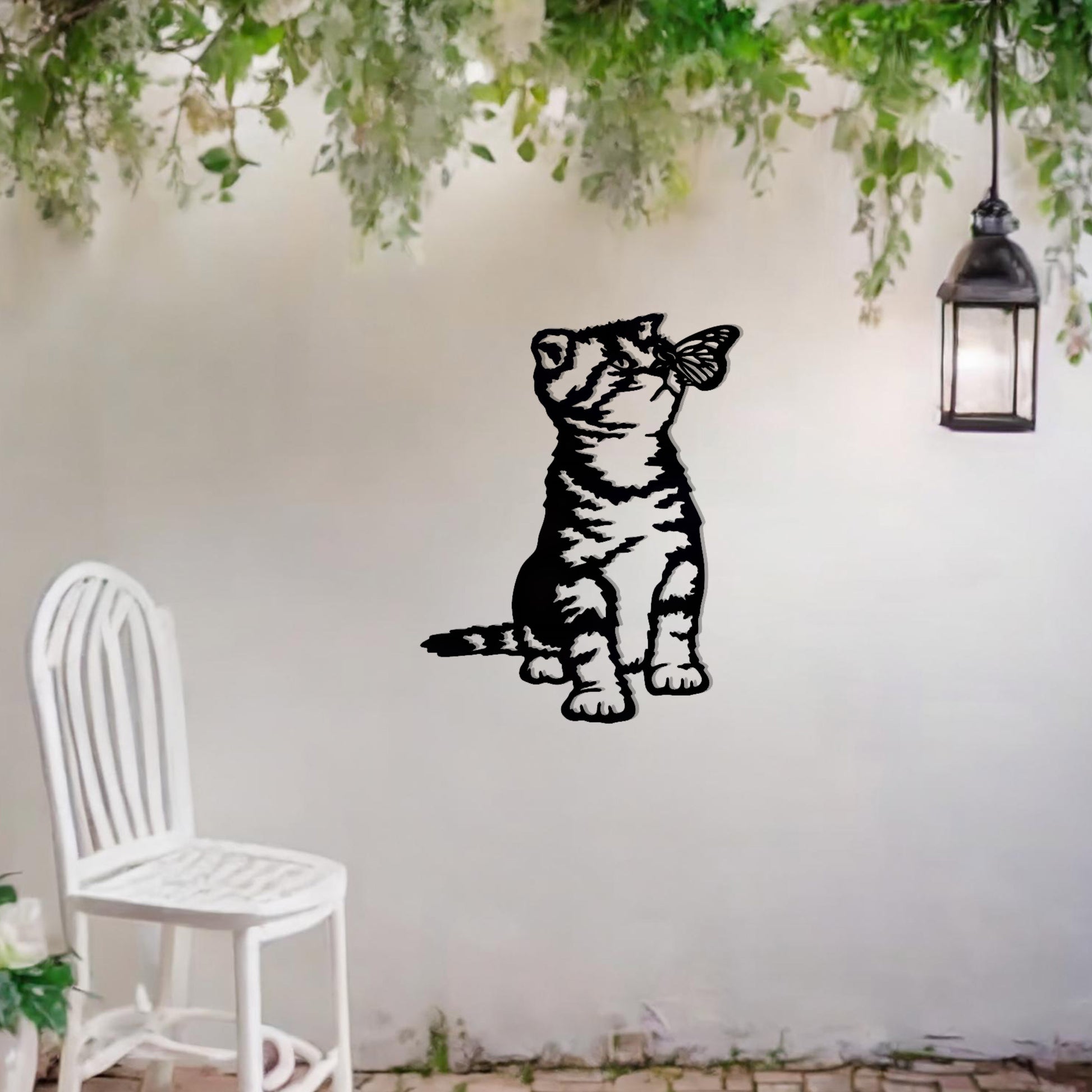This image shows a playful and endearing design of a kitten interacting with a butterfly. The cat, in a curious and playful pose, captures the essence of feline innocence and charm. It’s a delightful piece of wall art that would add a whimsical touch to any space.