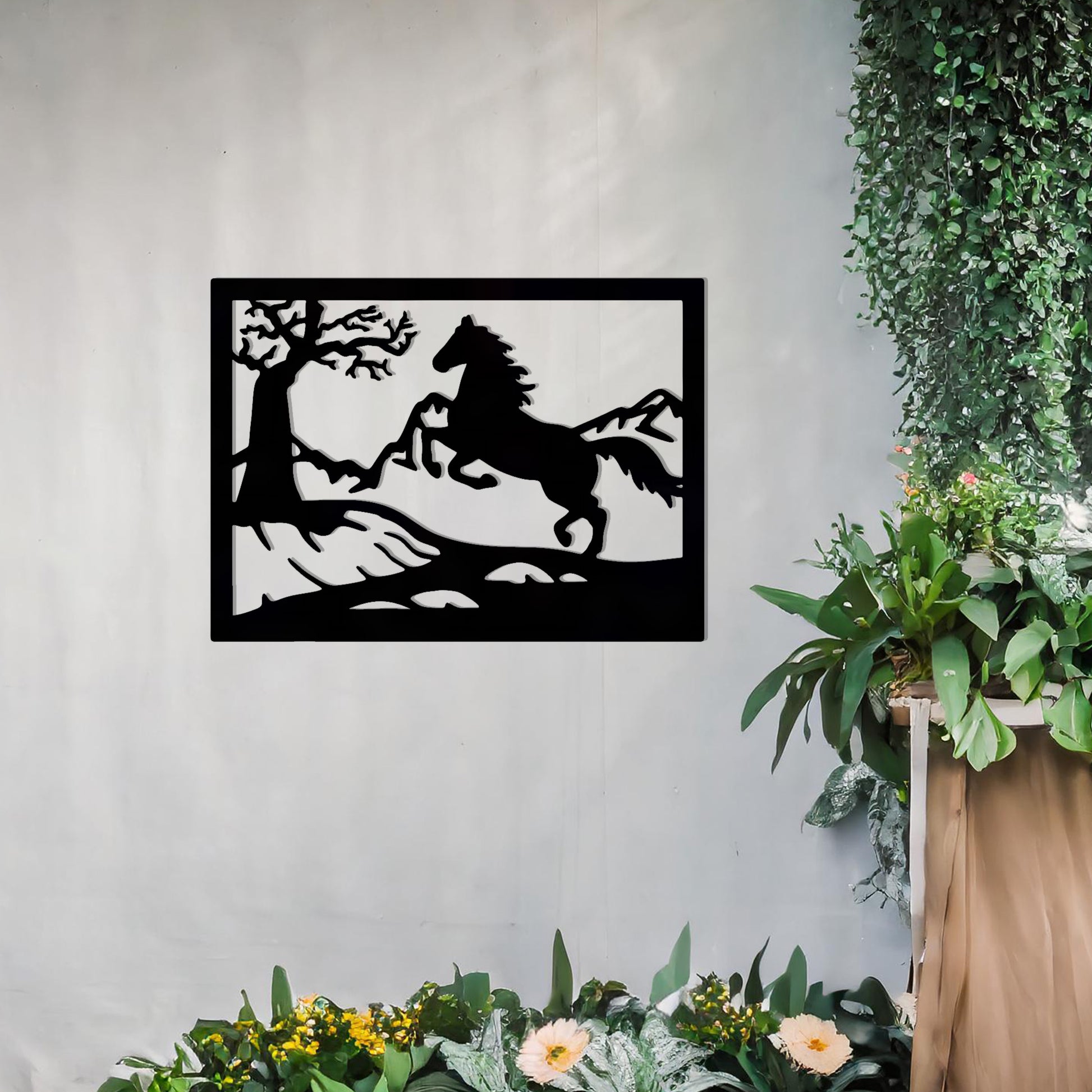 This wall art design depicts a majestic horse rearing up on a hillside, surrounded by a tree and mountain scenery, all encapsulated within a rectangular frame. A perfect addition for nature lovers and equestrian enthusiasts.