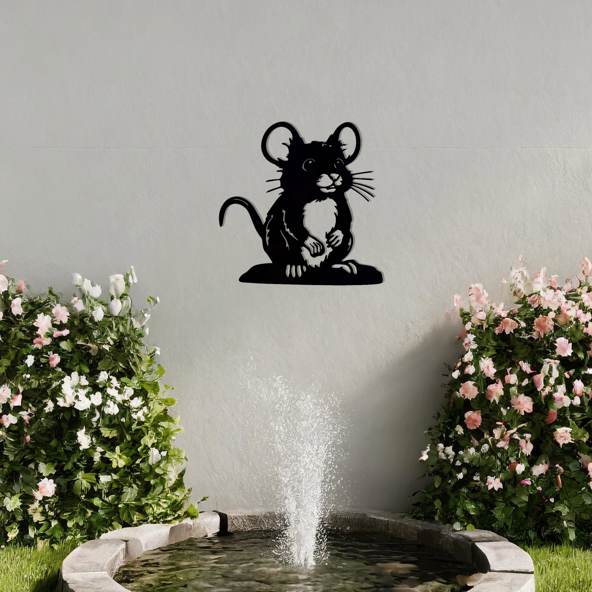 A delightful metal wall art piece featuring a whimsical mouse perched on a platform, adding a playful charm to a neutral wall. Perfect for modern garden decor, this design blends seamlessly with lush greenery and an outdoor water feature.
