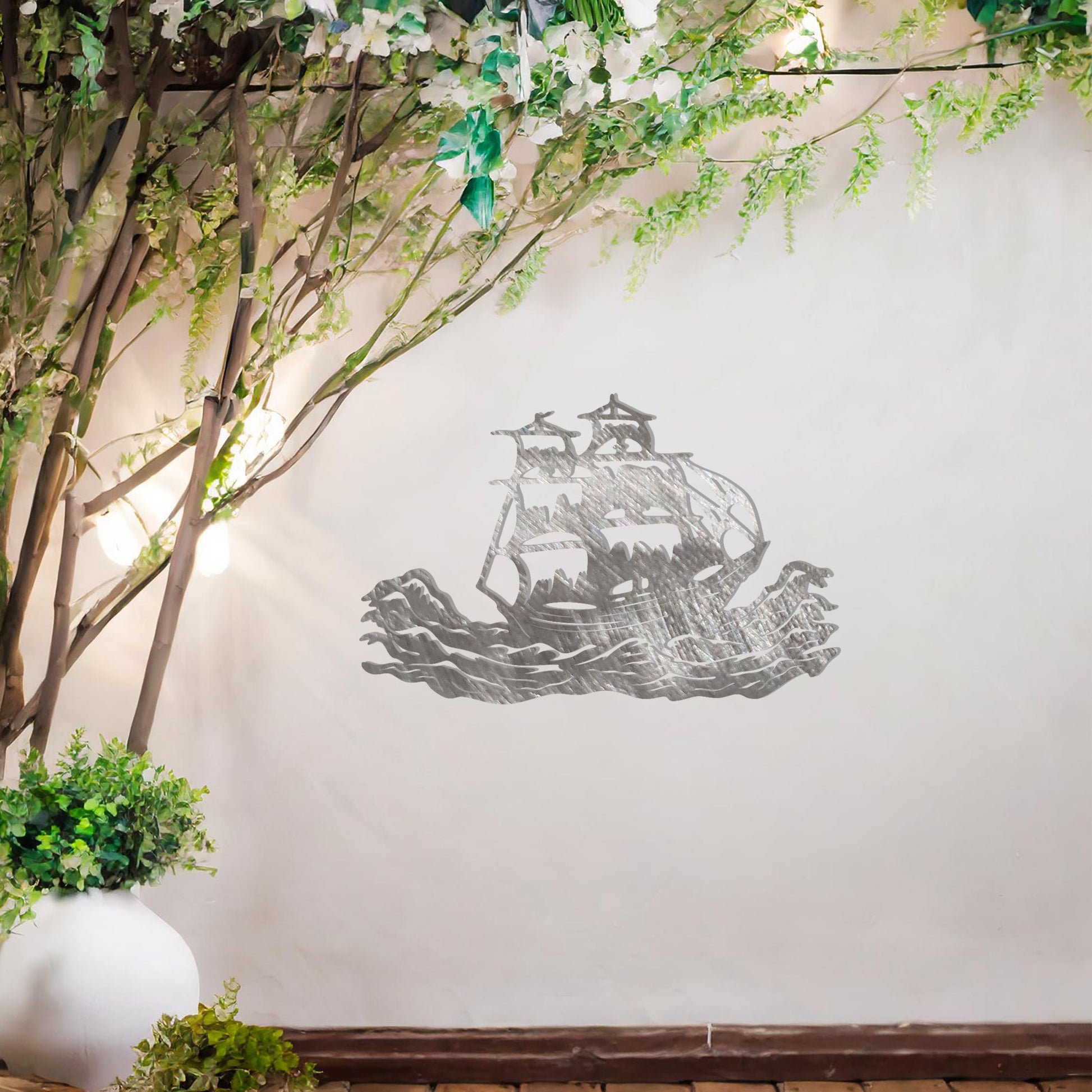 This design features an elegant silhouette of a sailing ship braving dynamic ocean waves, capturing a sense of adventure and exploration. The intricate details of the ship's sails and rigging make it a striking and timeless piece of decor.