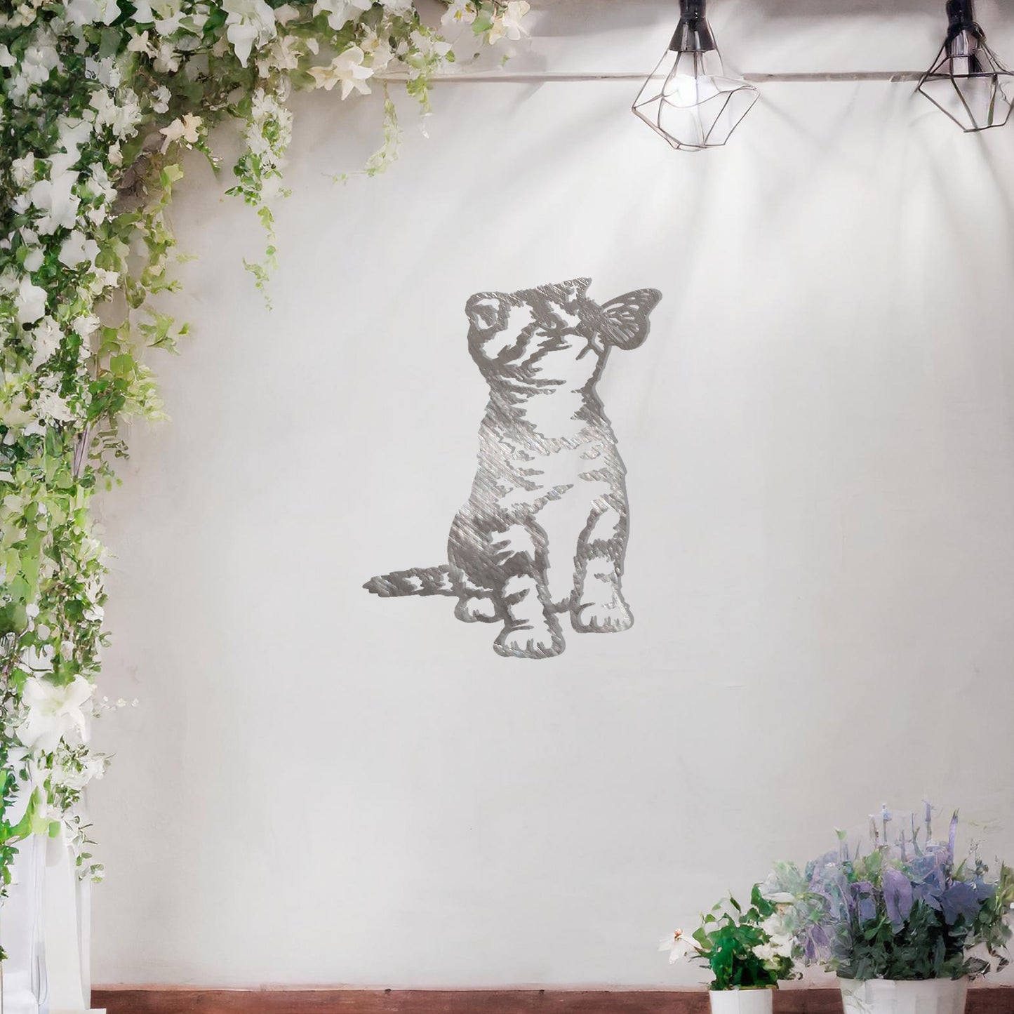 This image shows a playful and endearing design of a kitten interacting with a butterfly. The cat, in a curious and playful pose, captures the essence of feline innocence and charm. It’s a delightful piece of wall art that would add a whimsical touch to any space.