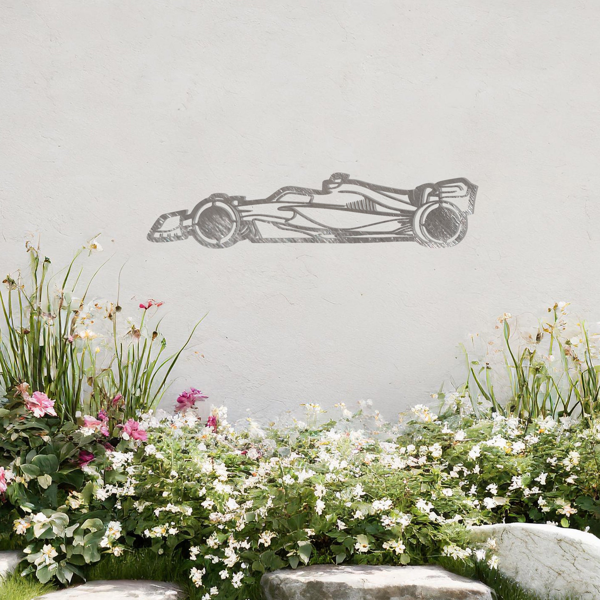 A sleek metal wall art design showcasing a detailed Formula 1 car silhouette. Perfect for motorsport enthusiasts, this artwork brings dynamic energy to modern or contemporary spaces. It is displayed on a neutral wall in a stylish outdoor setting.