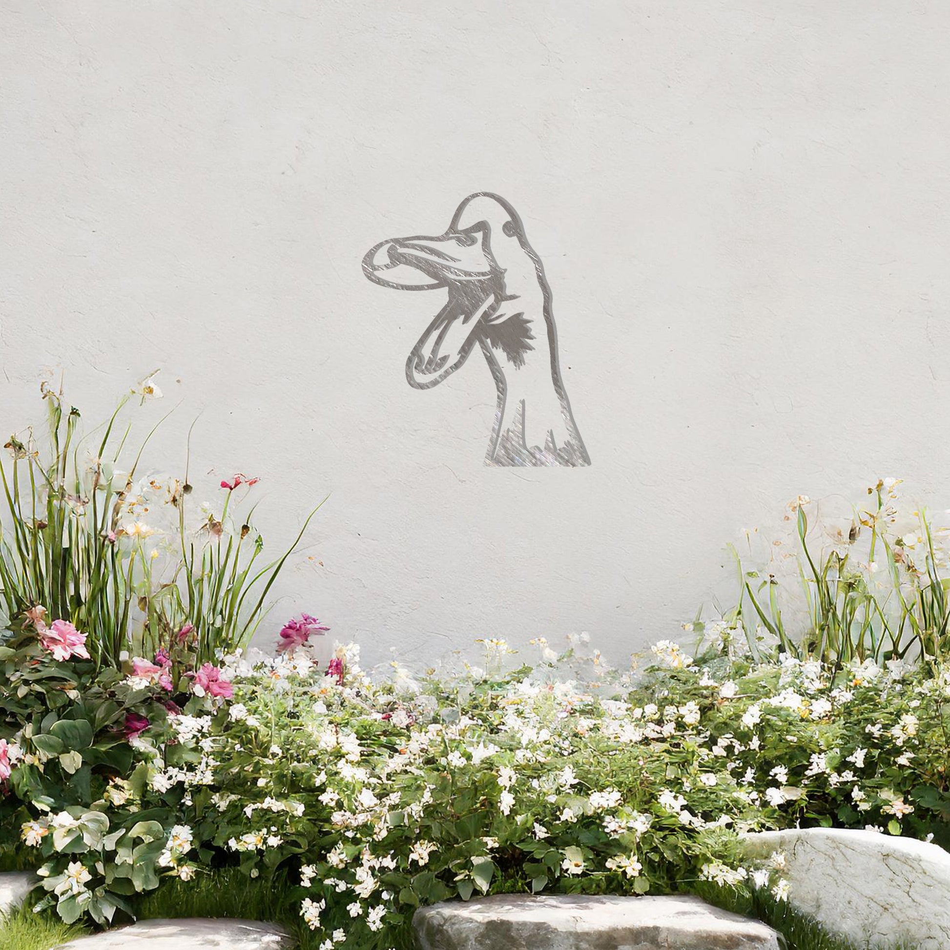 A quirky metal wall art of a duck with an open beak, showcasing playful and artistic detail. This unique design adds a touch of humor and charm to any modern setting, surrounded by greenery and soft floral accents.